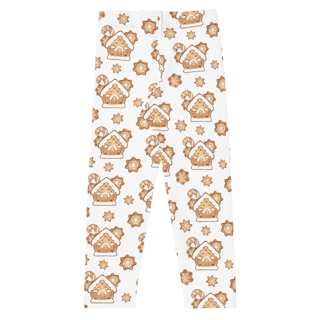 White kids buttery soft leggings with festive brown gingerbread houses candy canes and snowflakes pattern