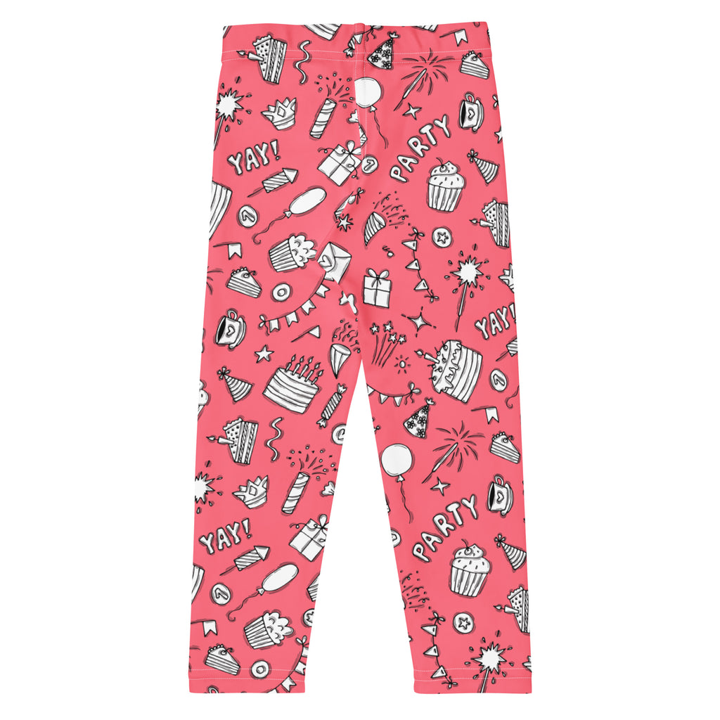 Girls pink buttery soft leggings with playful birthday party pattern of cupcakes cakes balloons and fireworks