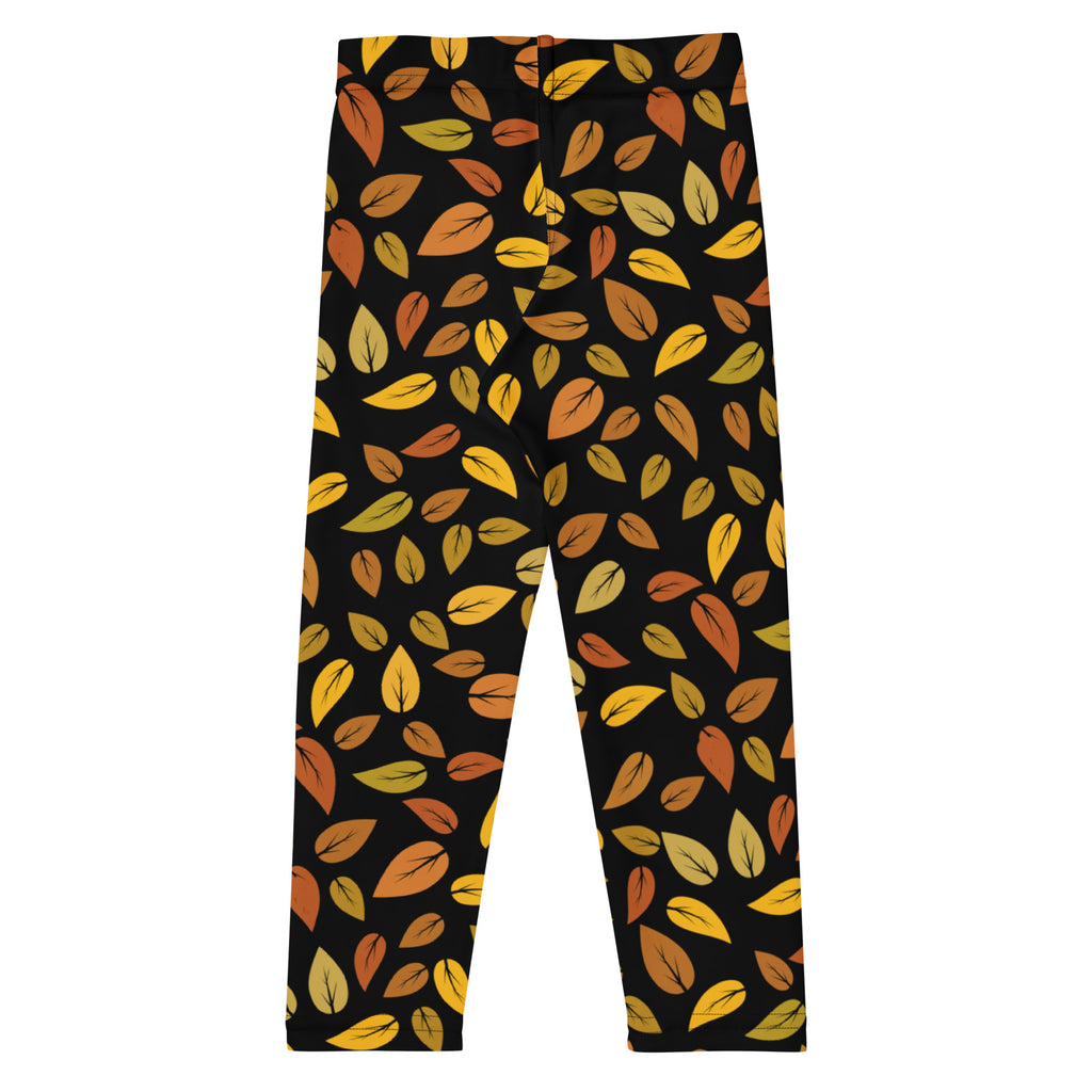 Kids autumn leaf buttery soft leggings in black with vibrant yellow orange and brown autumn leaf pattern