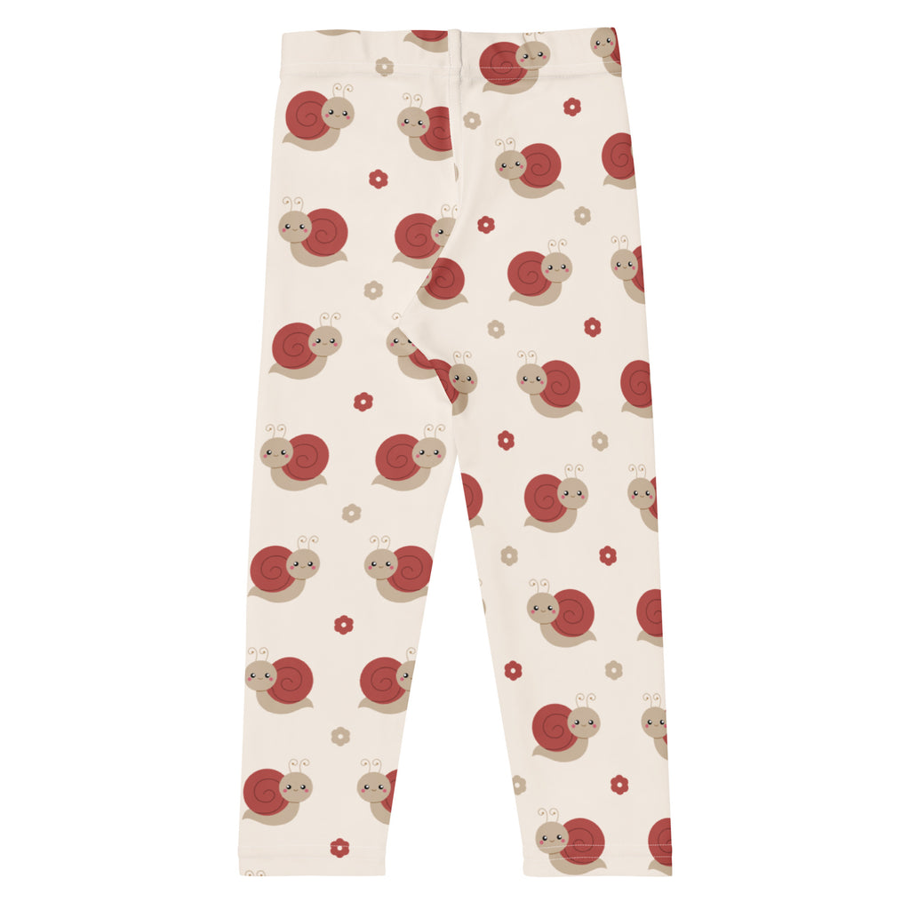 Cream-colored girls leggings with red and beige snail pattern and small flowers made of buttery soft fabric