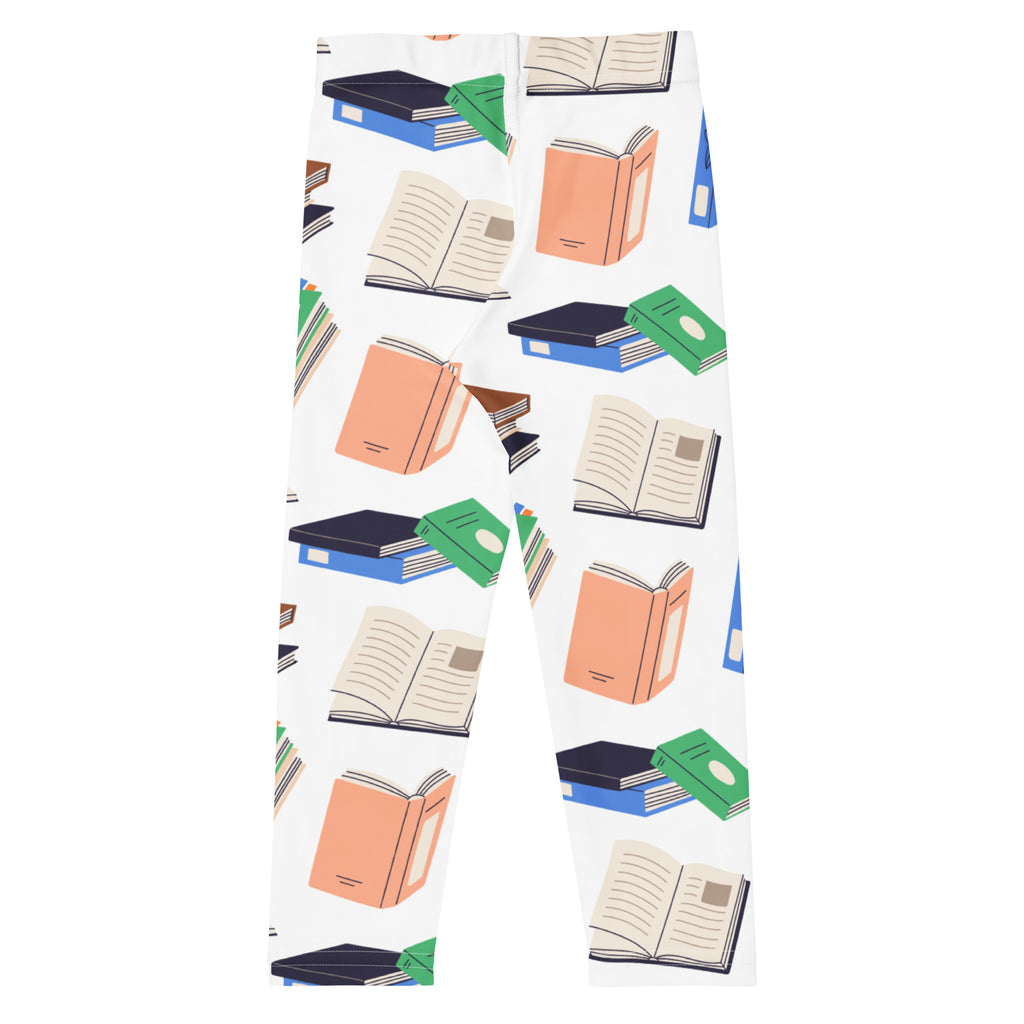 White kids book print buttery soft leggings featuring playful orange green and navy illustrated book pattern