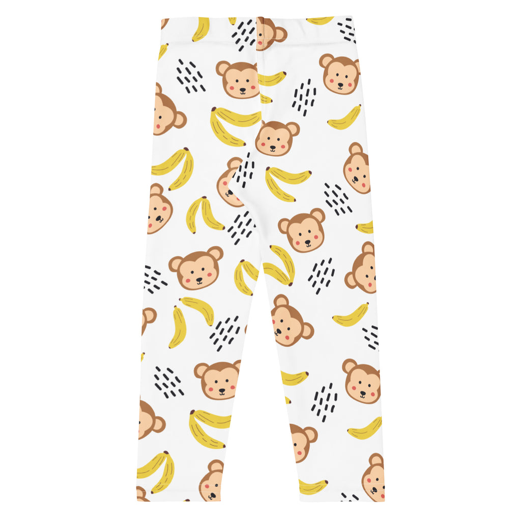 White kids leggings with playful brown black and yellow cartoon monkeys and bananas buttery soft fabric