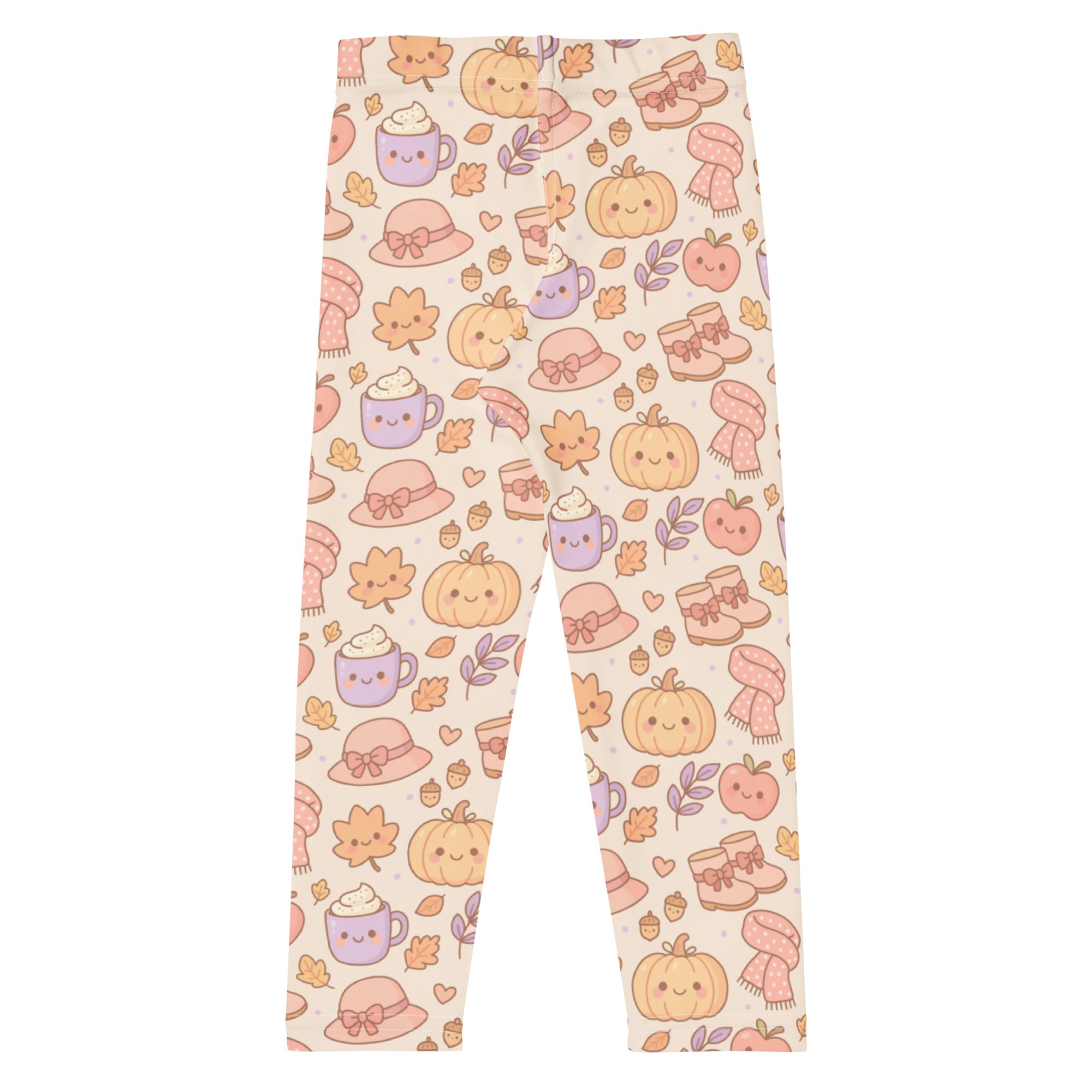 Cream-colored buttery soft kids leggings with playful autumn pattern of smiling pumpkins, cozy hats, and steaming mugs