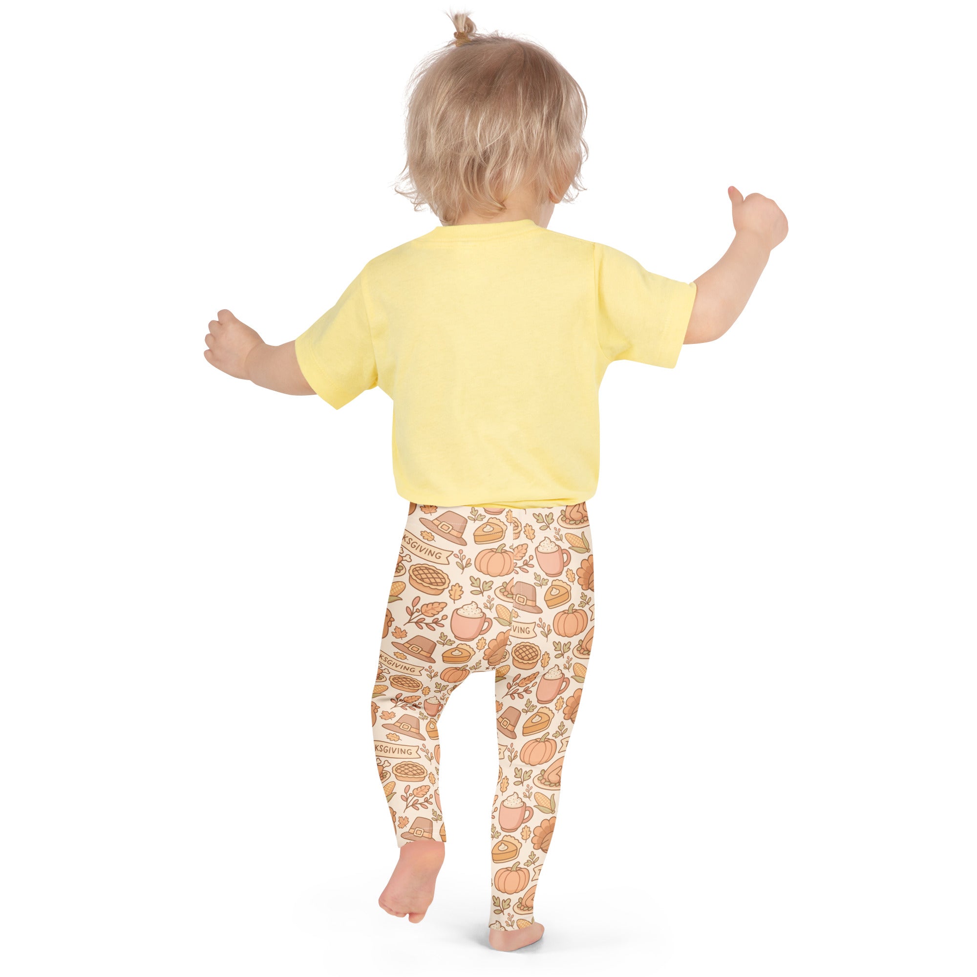 Kids thanksgiving buttery soft leggings beige with autumn pumpkin pie leaf pattern paired with yellow short sleeve shirt