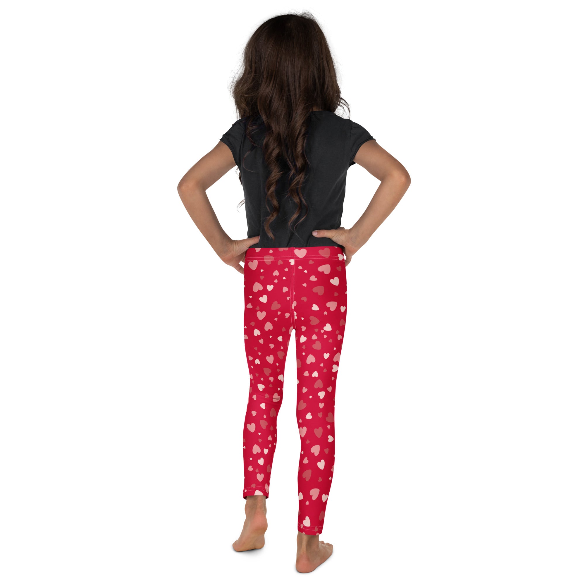 Girls red heart print buttery soft leggings in red worn by a child featuring a comfortable stretchy fit