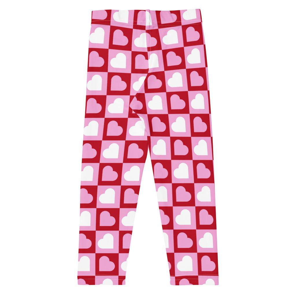 Girls pink checkered heart buttery soft leggings featuring pink and red heart patterns with a checkered design