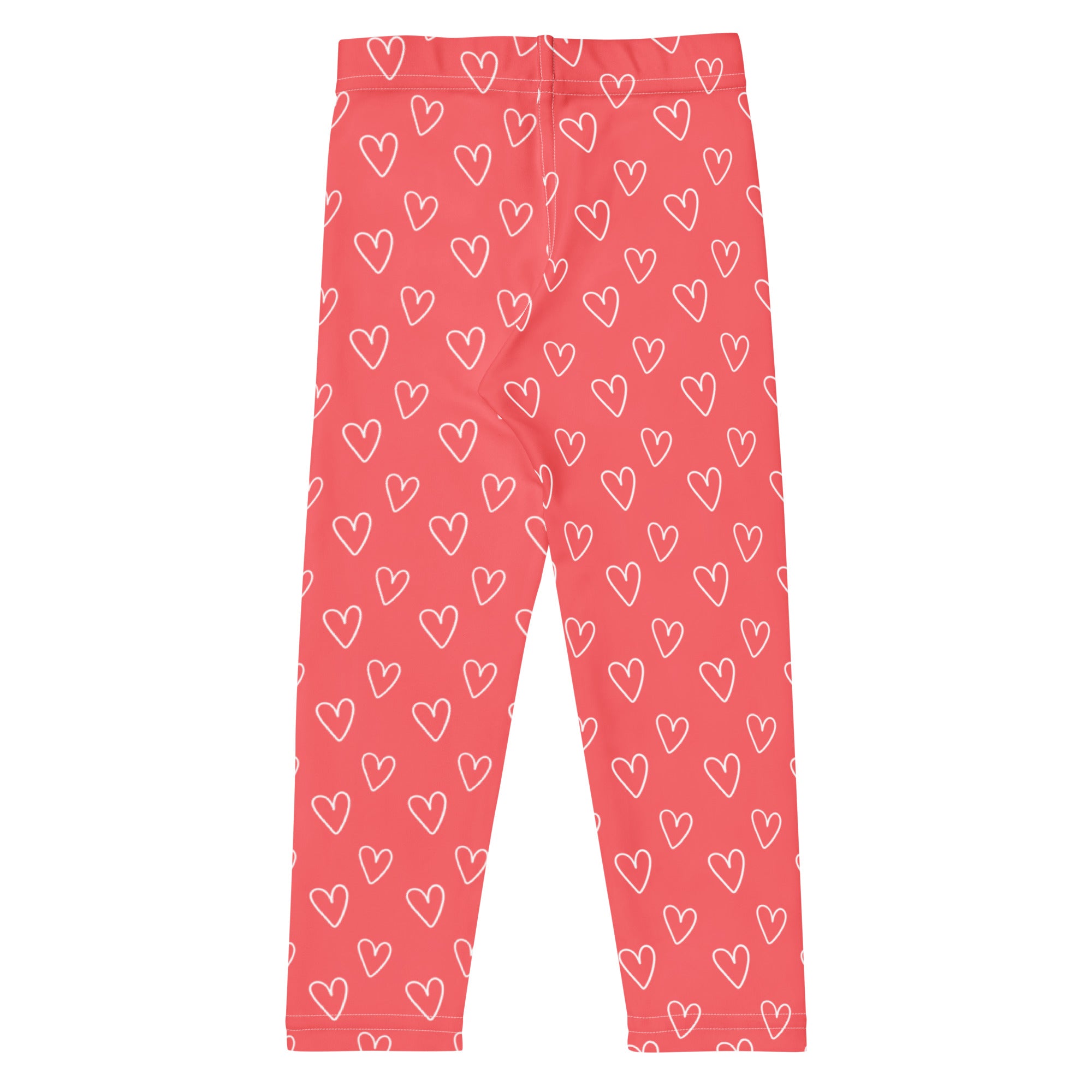 Girls pink buttery soft leggings with white heart outlines featuring a playful all over pattern