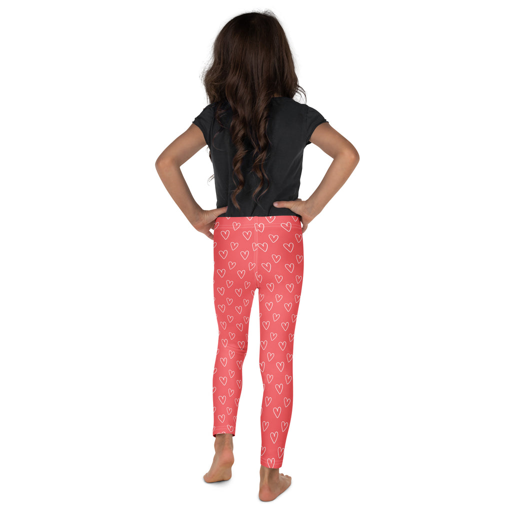 Girls pink buttery soft leggings with white outlined heart pattern perfect for casual wear