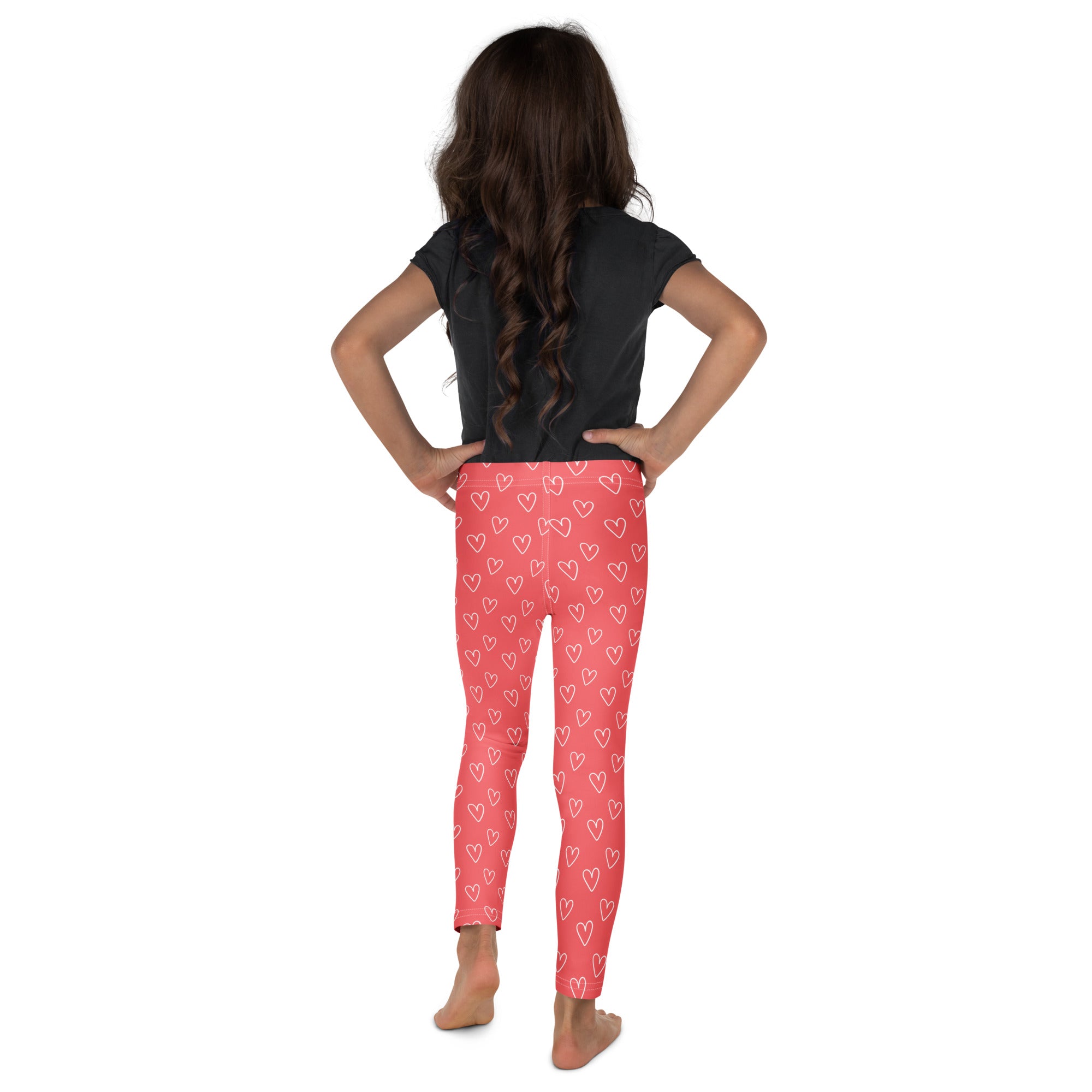 Girls pink buttery soft leggings with white outlined heart pattern perfect for casual wear