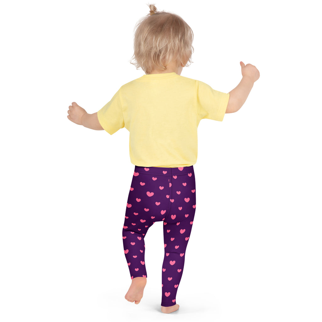 Girls purple heart leggings buttery soft purple leggings with pink heart patterns worn by a child