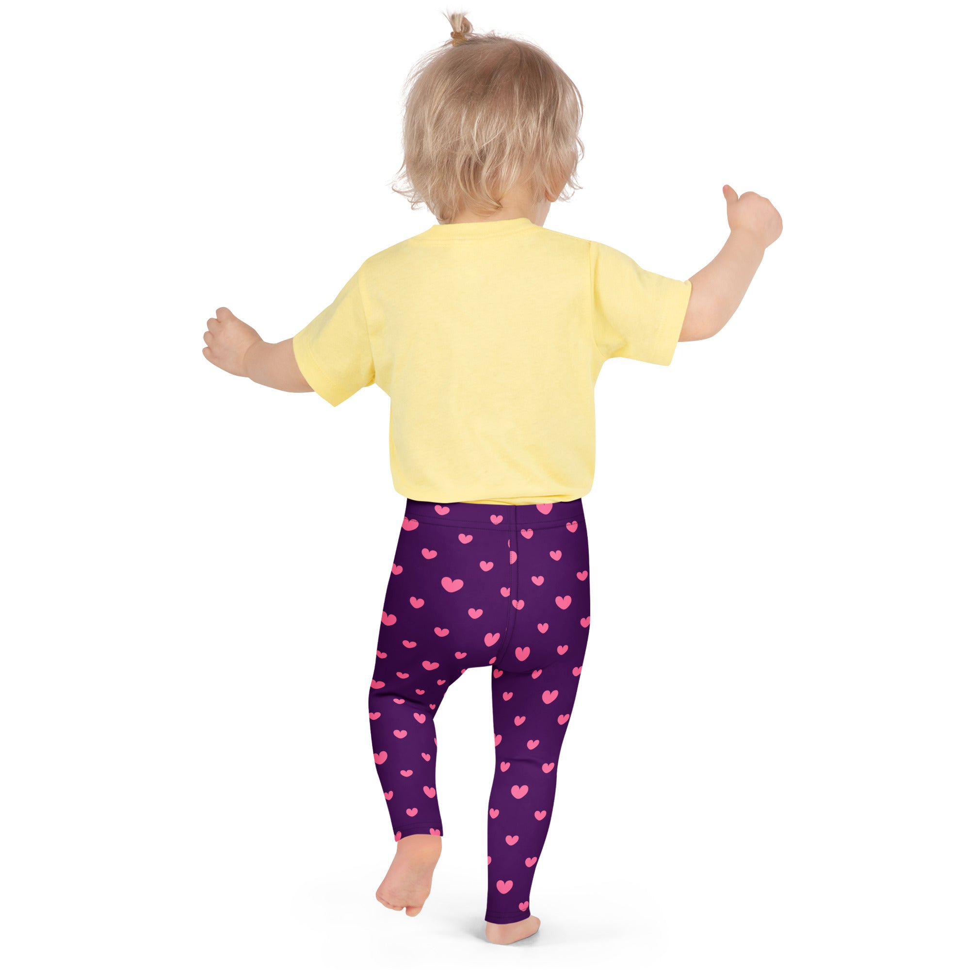 Girls purple heart leggings buttery soft purple leggings with pink heart patterns worn by a child
