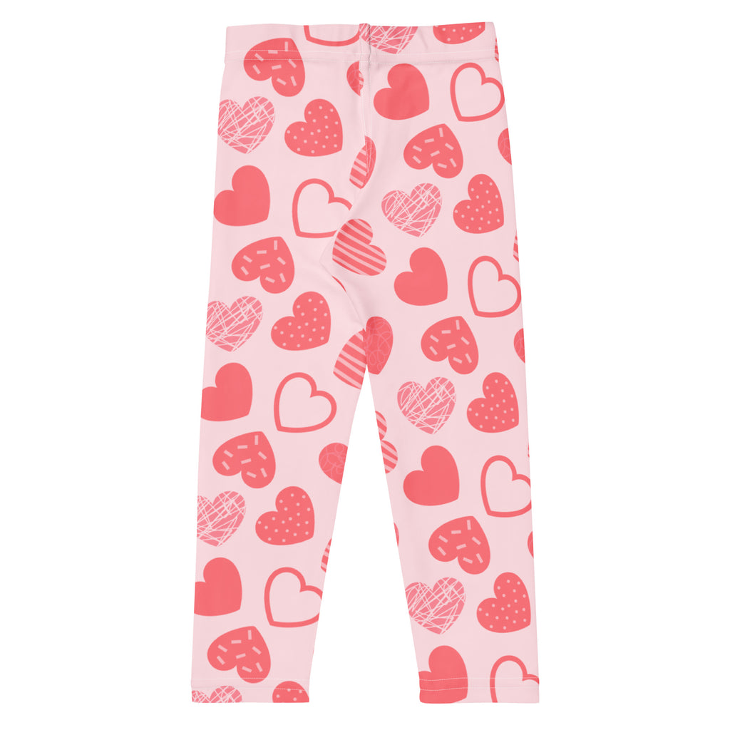 Girls pink heart pattern leggings with buttery soft stretchy fabric and playful red and white designs
