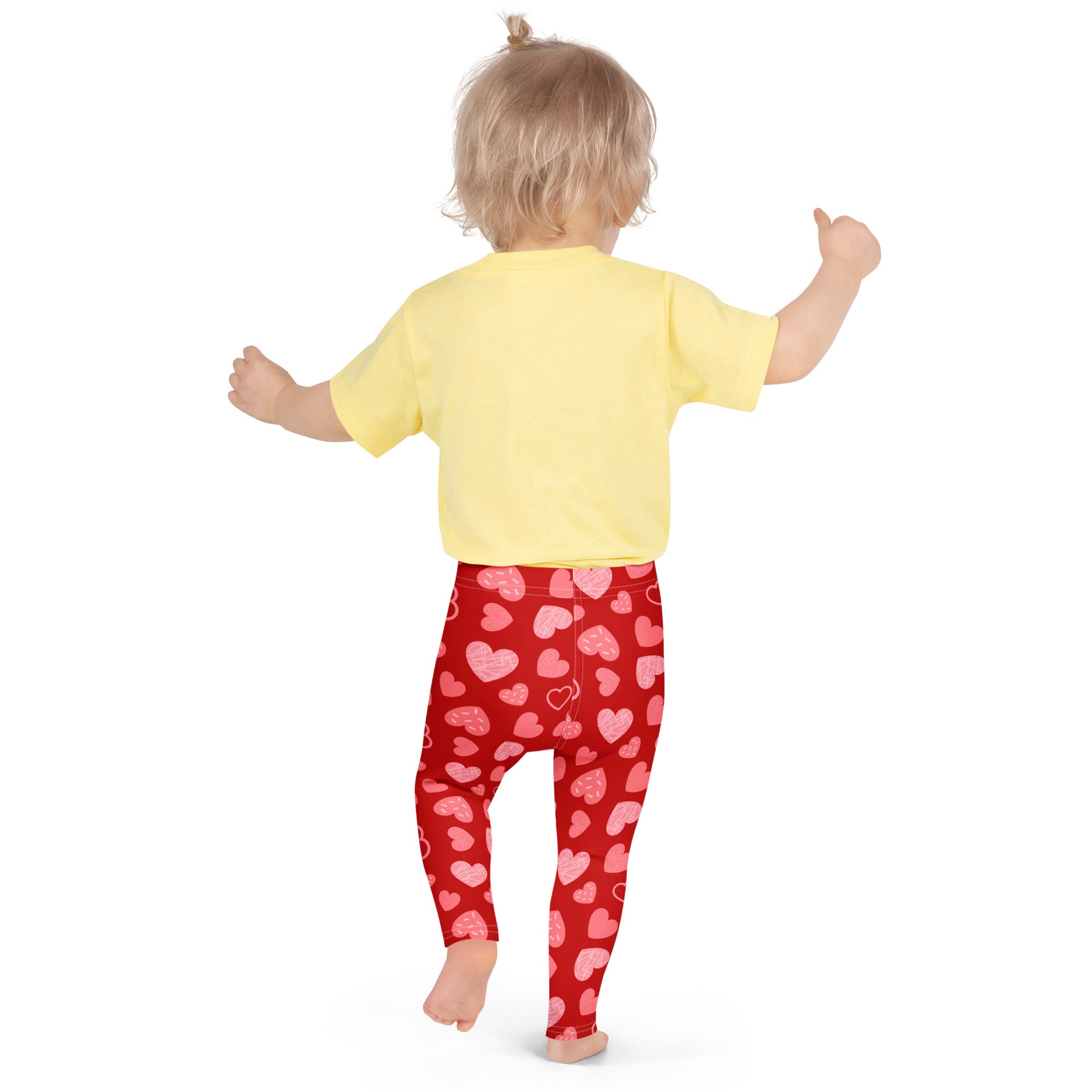 Girls red heart pattern leggings in buttery soft fabric featuring pink hearts and comfortable fit