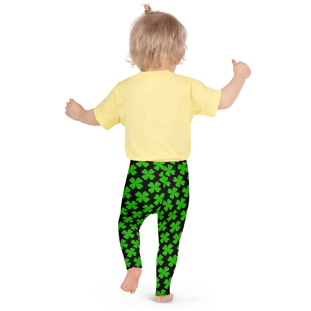 Girls black and green shamrock buttery soft leggings with bright green four-leaf clover pattern on child