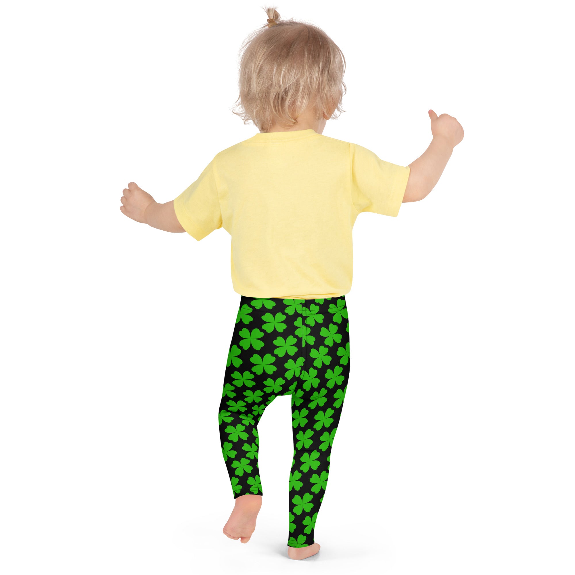 Girls black and green shamrock buttery soft leggings with bright green four-leaf clover pattern on child