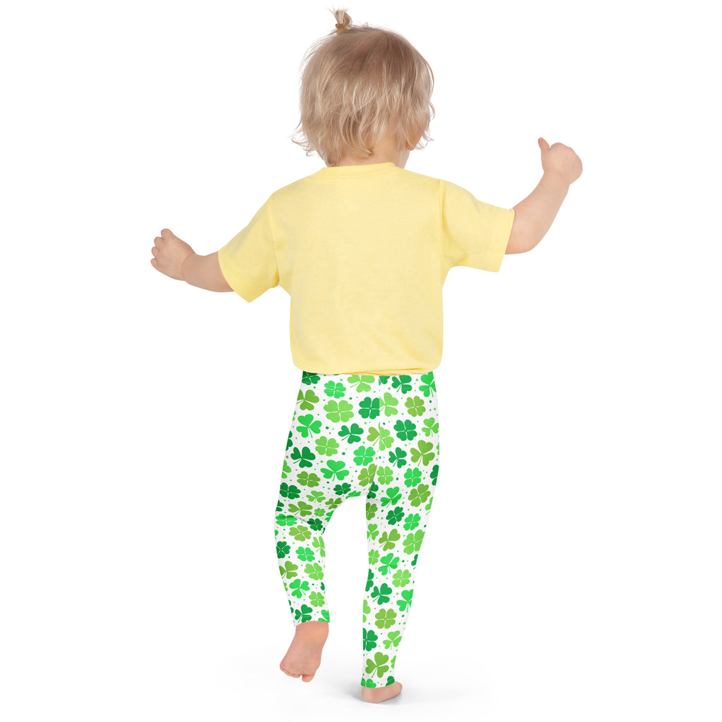 Girls lucky shamrock buttery soft white leggings with green four leaf clover pattern paired with yellow short sleeve t-shirt