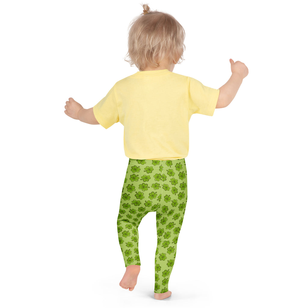 Girls lime green shamrock buttery soft leggings with bright green fabric and repeating shamrock pattern
