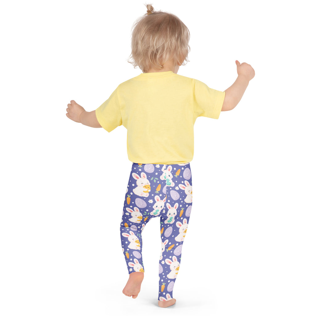 A child wearing girls purple easter bunny buttery soft leggings with white bunnies carrots and pastel eggs pattern