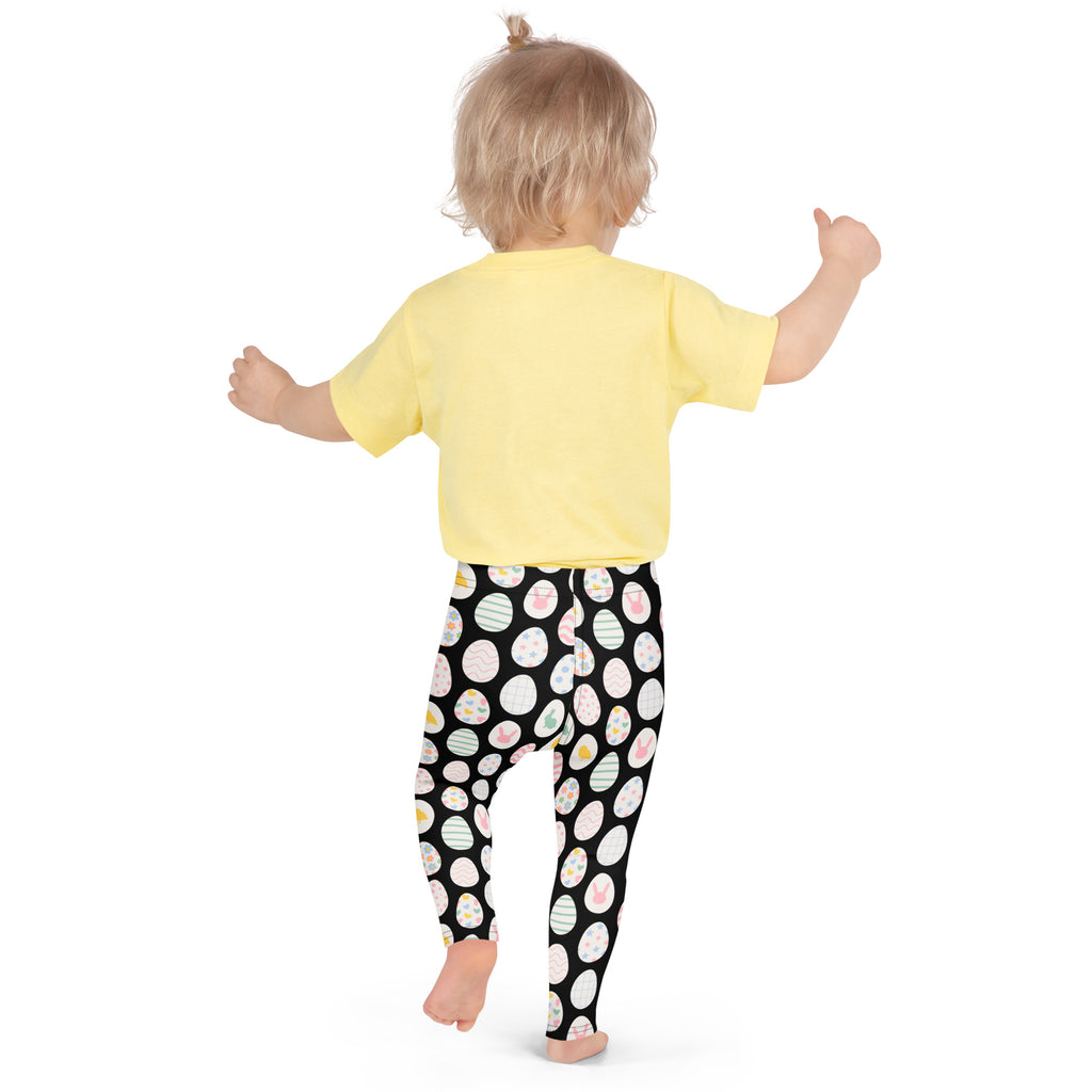 Girls black Easter egg buttery soft leggings featuring colorful striped Easter eggs and a playful pattern