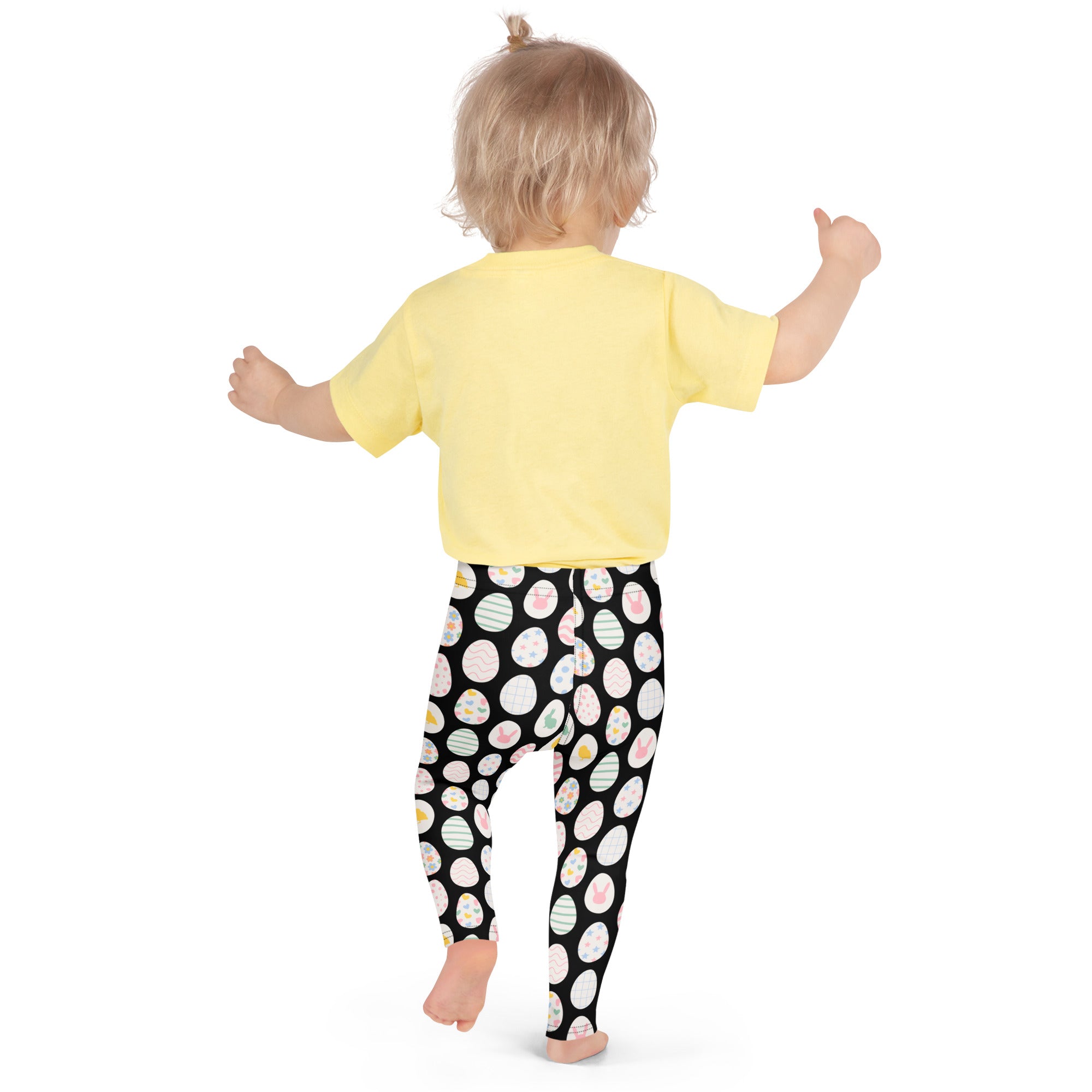 Girls black Easter egg buttery soft leggings featuring colorful striped Easter eggs and a playful pattern
