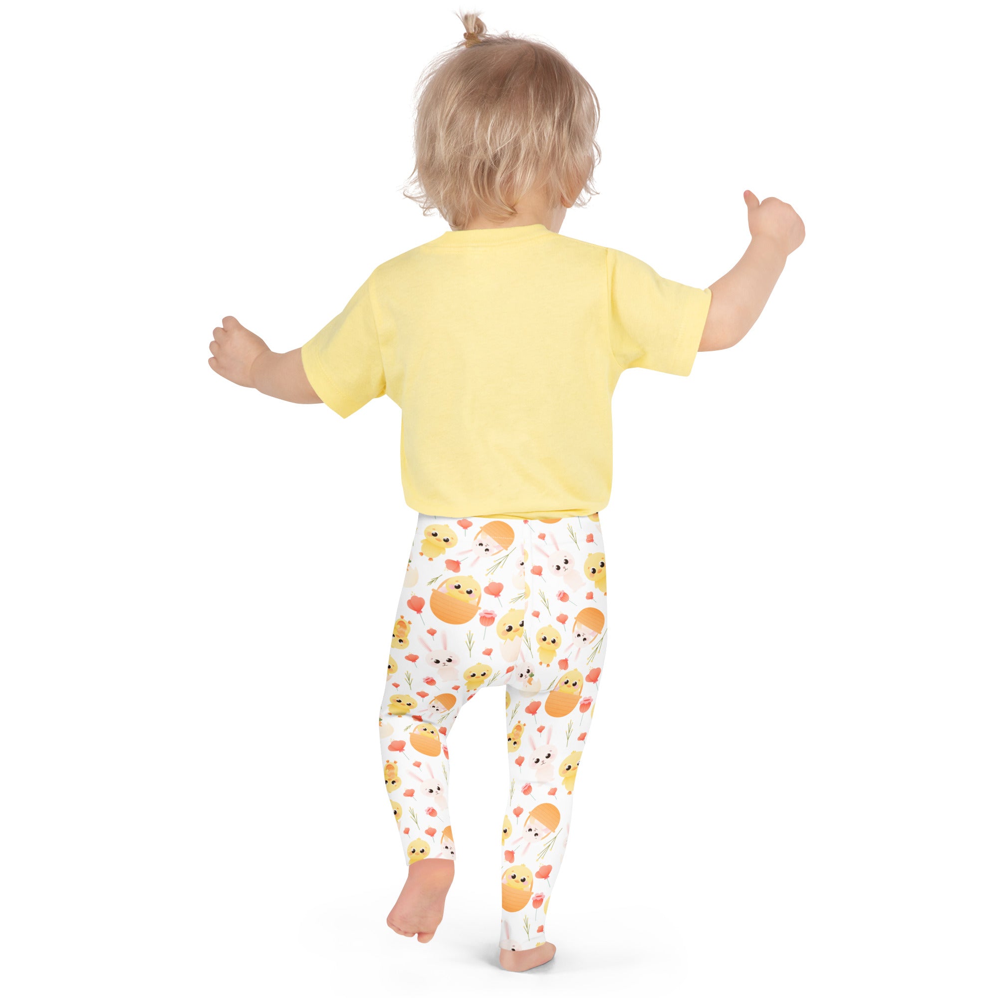 Yellow short-sleeved shirt paired with buttery soft white leggings with orange chicks and pink flowers for girls