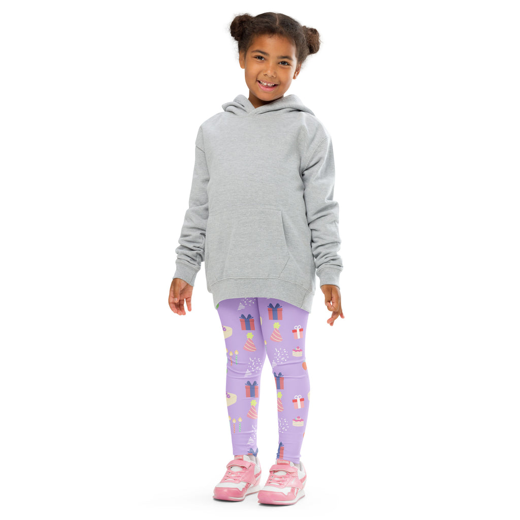 A child wearing girls birthday buttery soft lavender leggings with colorful gift and cake patterns and a gray hoodie