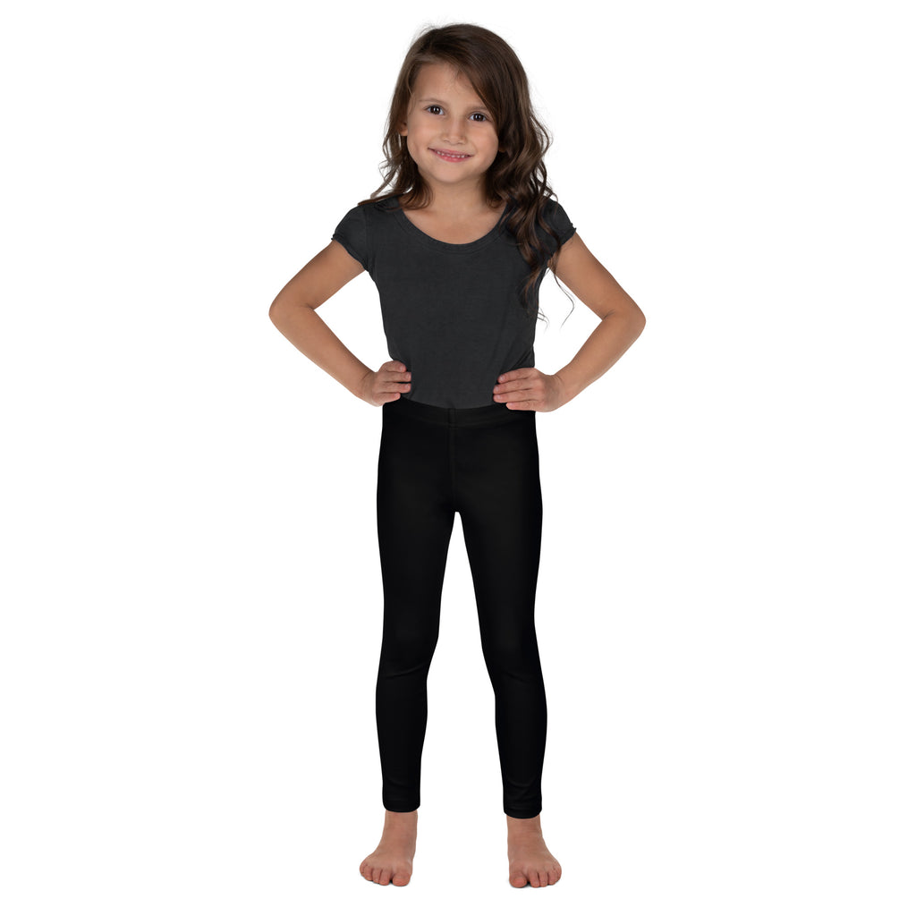 Young girl wearing black buttery soft stretchy leggings designed for kids comfort and flexibility
