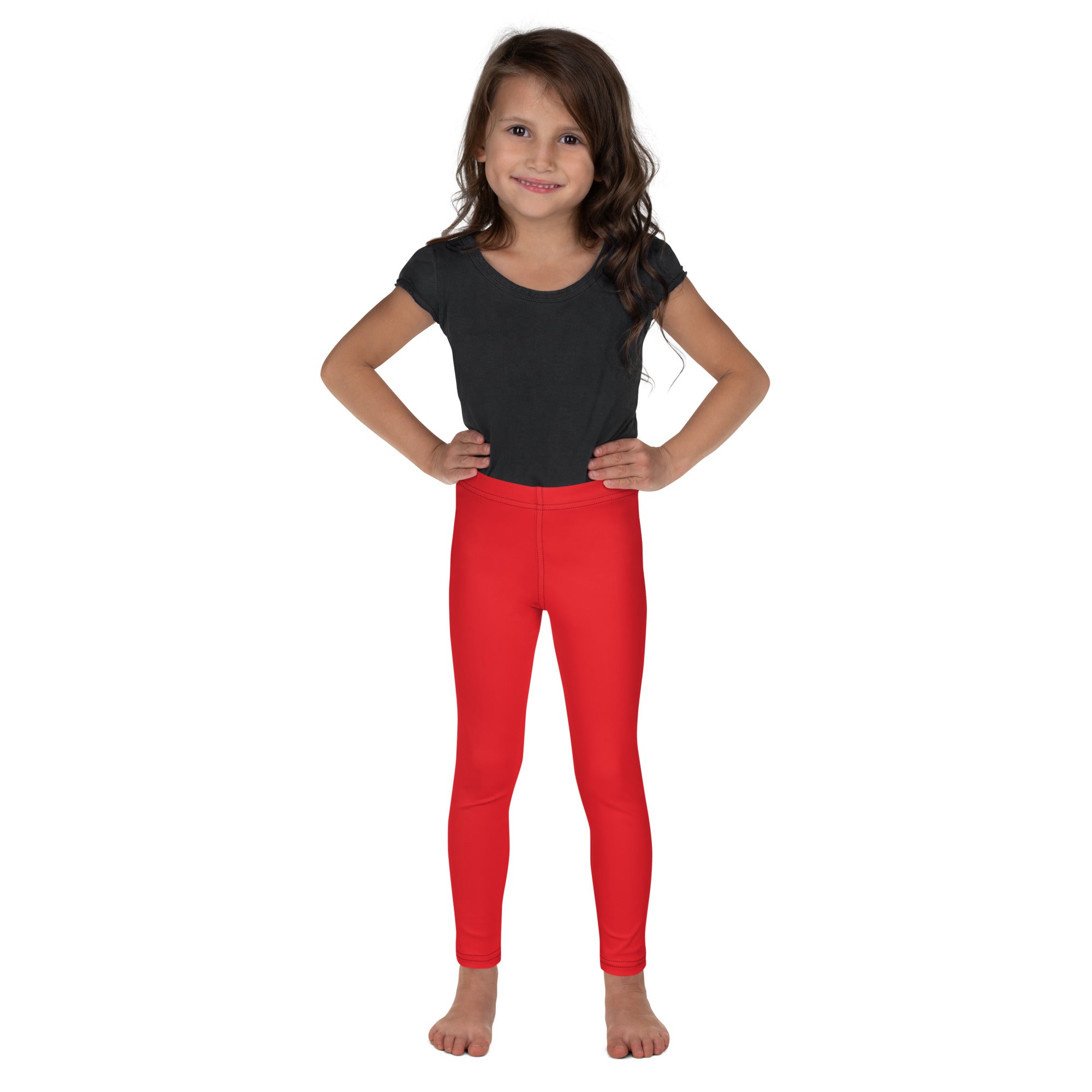 Bright red kids buttery soft leggings worn by a young girl showcasing form fitting comfortable design