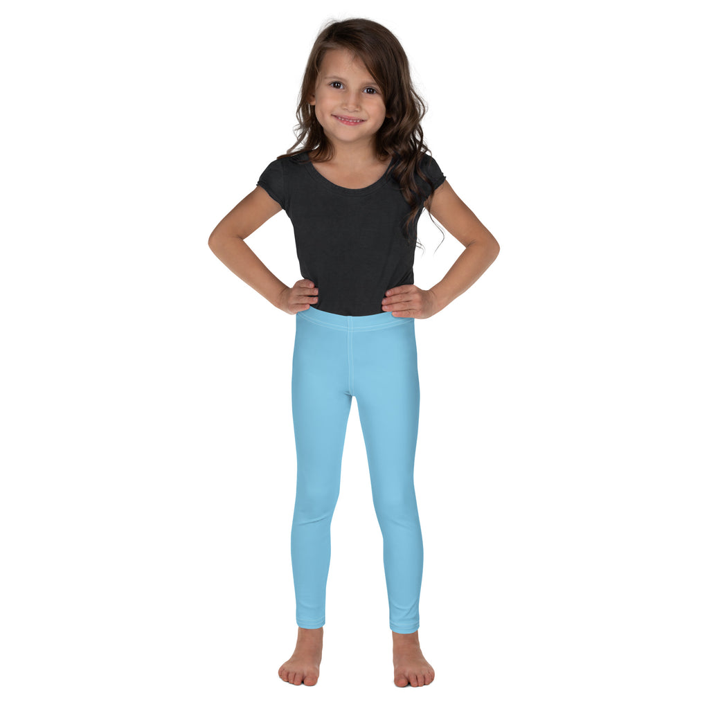 Young girl wearing light blue buttery soft leggings that are form fitting and comfortable for kids