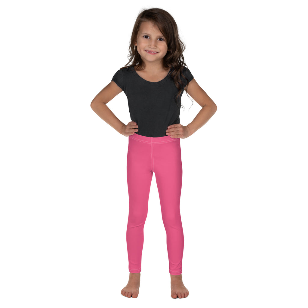 Girls buttery soft pink leggings in bright pink form fitting fabric worn by a young girl