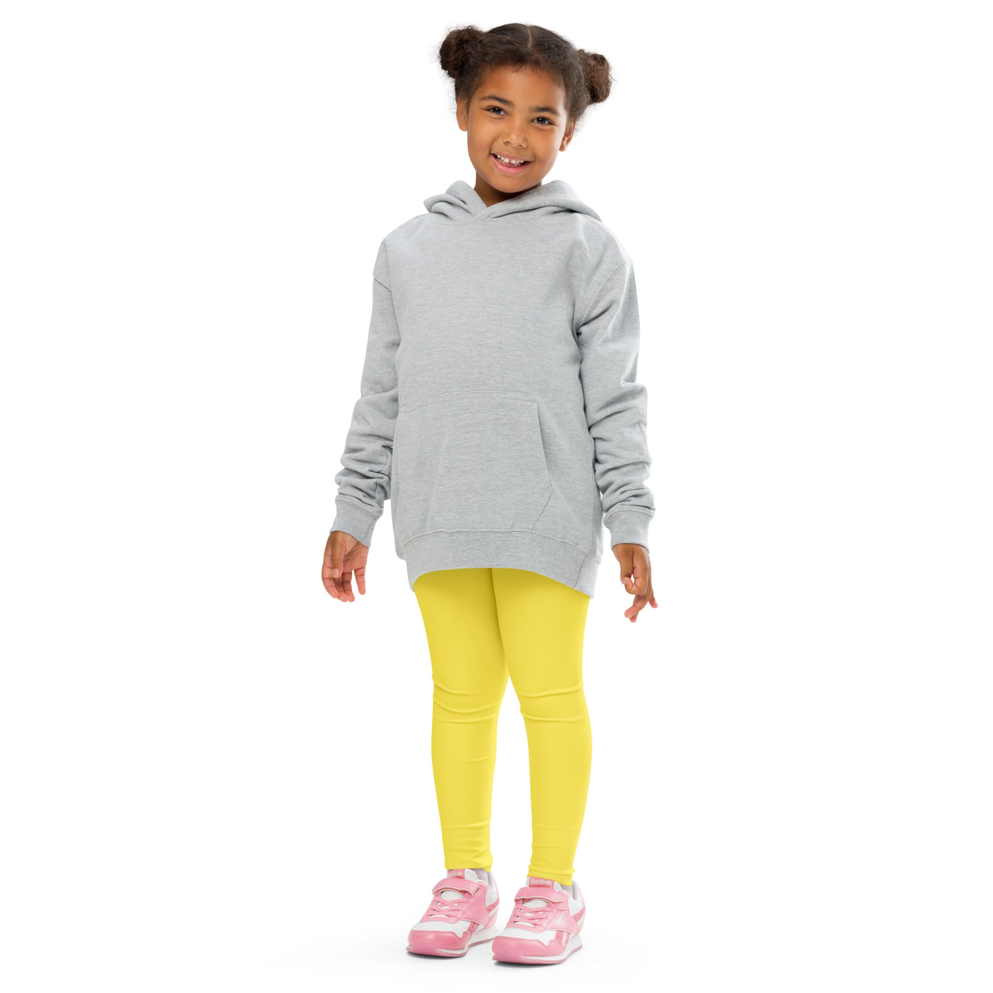 Gray hooded sweatshirt with front pocket and long sleeves paired with kids buttery soft yellow leggings