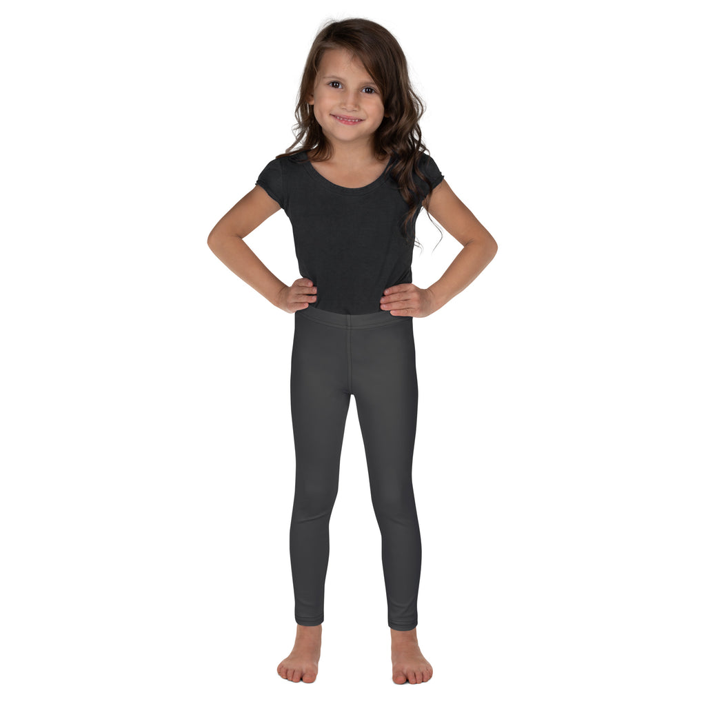 Young girl wearing a black short-sleeved top and kids buttery soft gray leggings in dark gray stretchy fabric