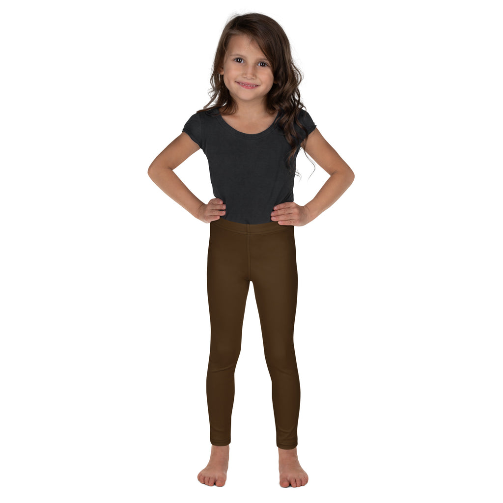 A child wearing buttery soft brown kids leggings paired with a dark gray short sleeve top