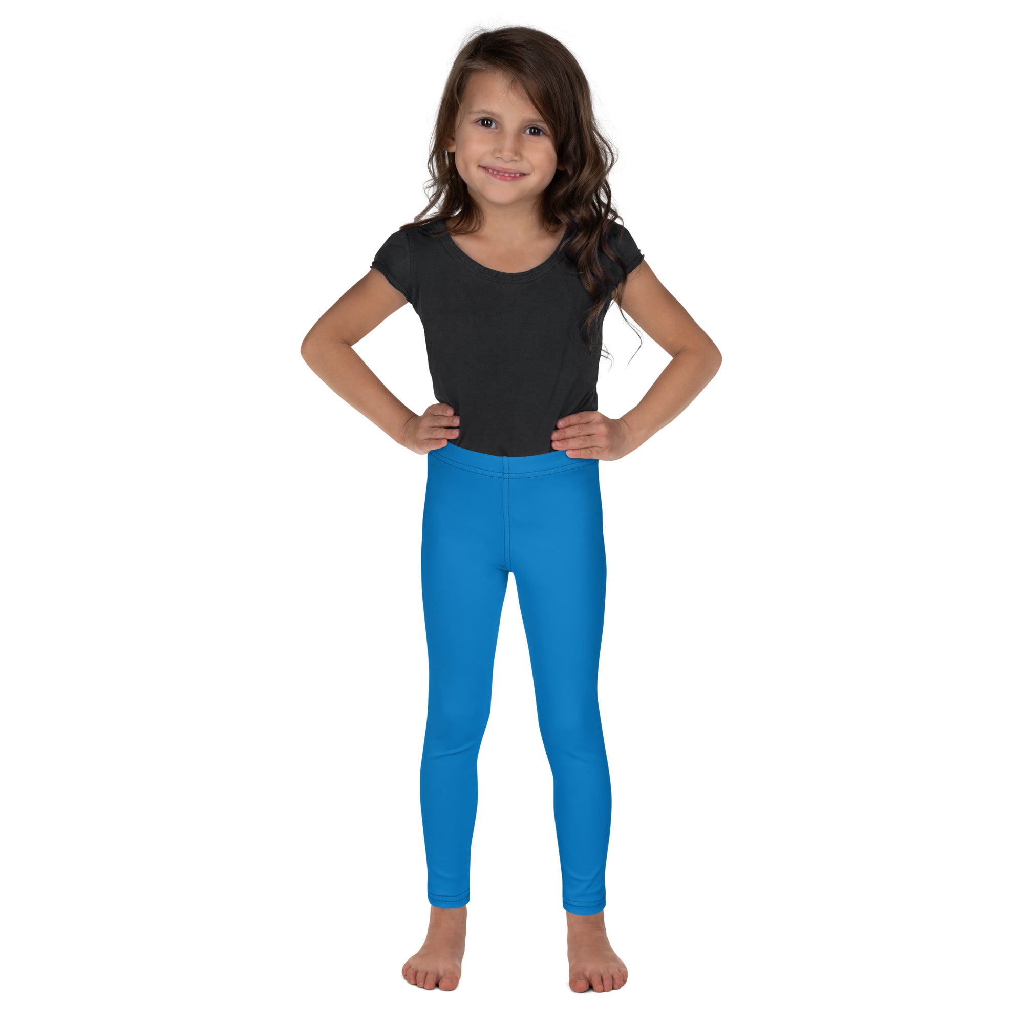 Bright blue kids buttery soft leggings worn by a young girl showcasing a form-fitting comfortable fit