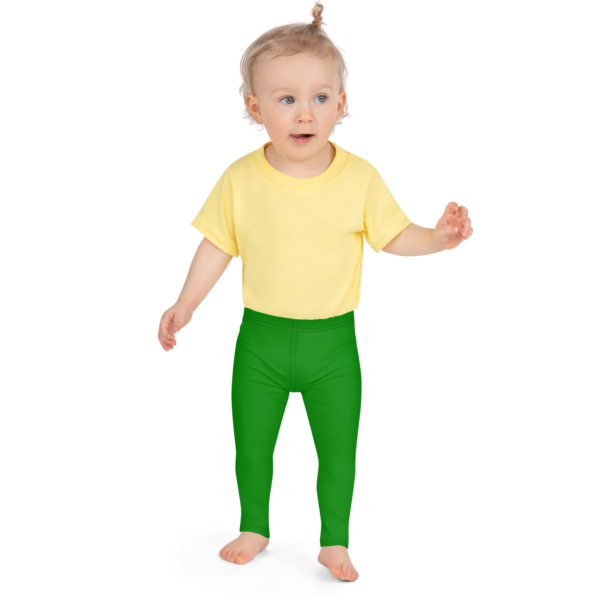 A toddler wearing kids buttery soft green leggings paired with a bright yellow short-sleeved t-shirt