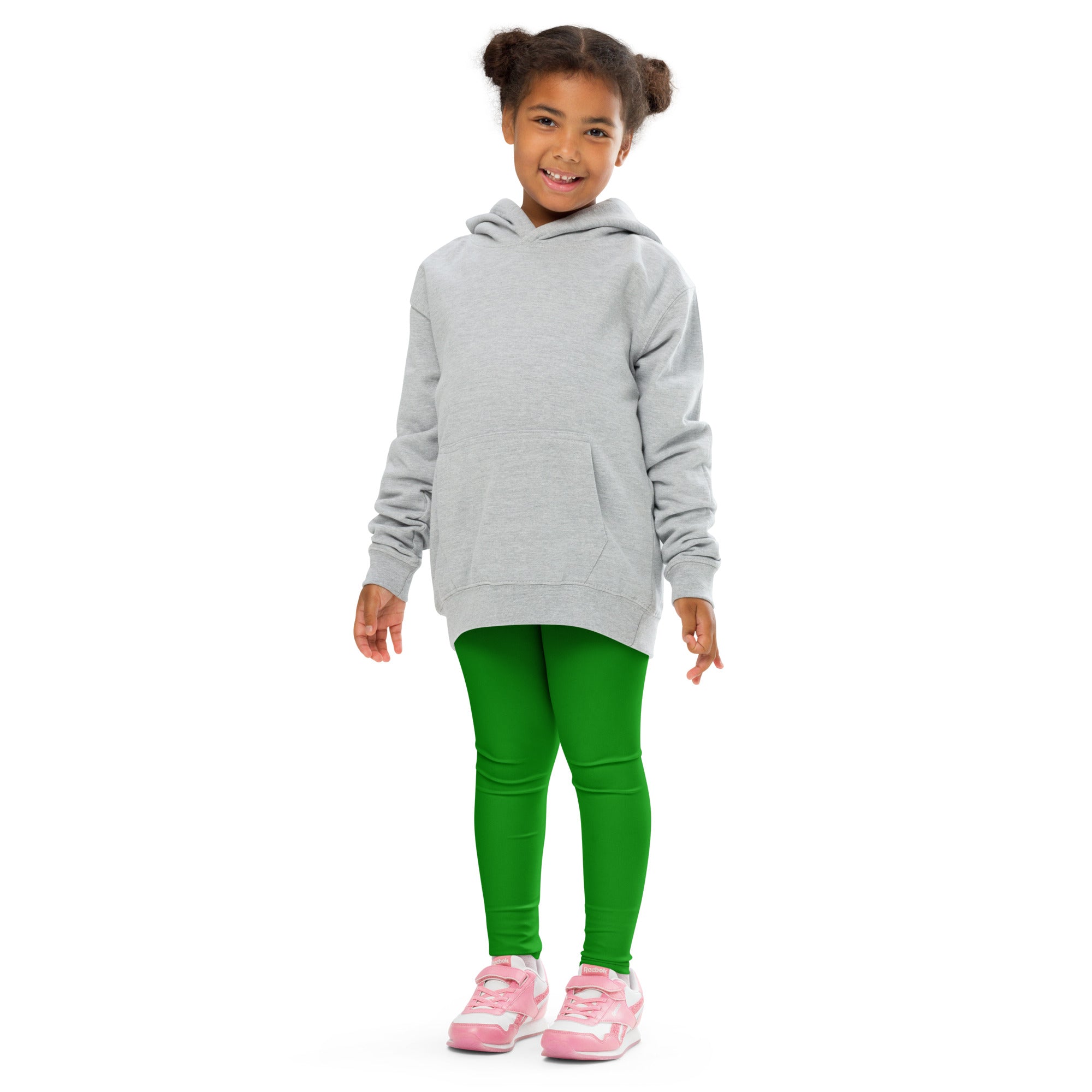 A child wearing buttery soft bright green kids leggings paired with a light gray hooded sweatshirt with long sleeves