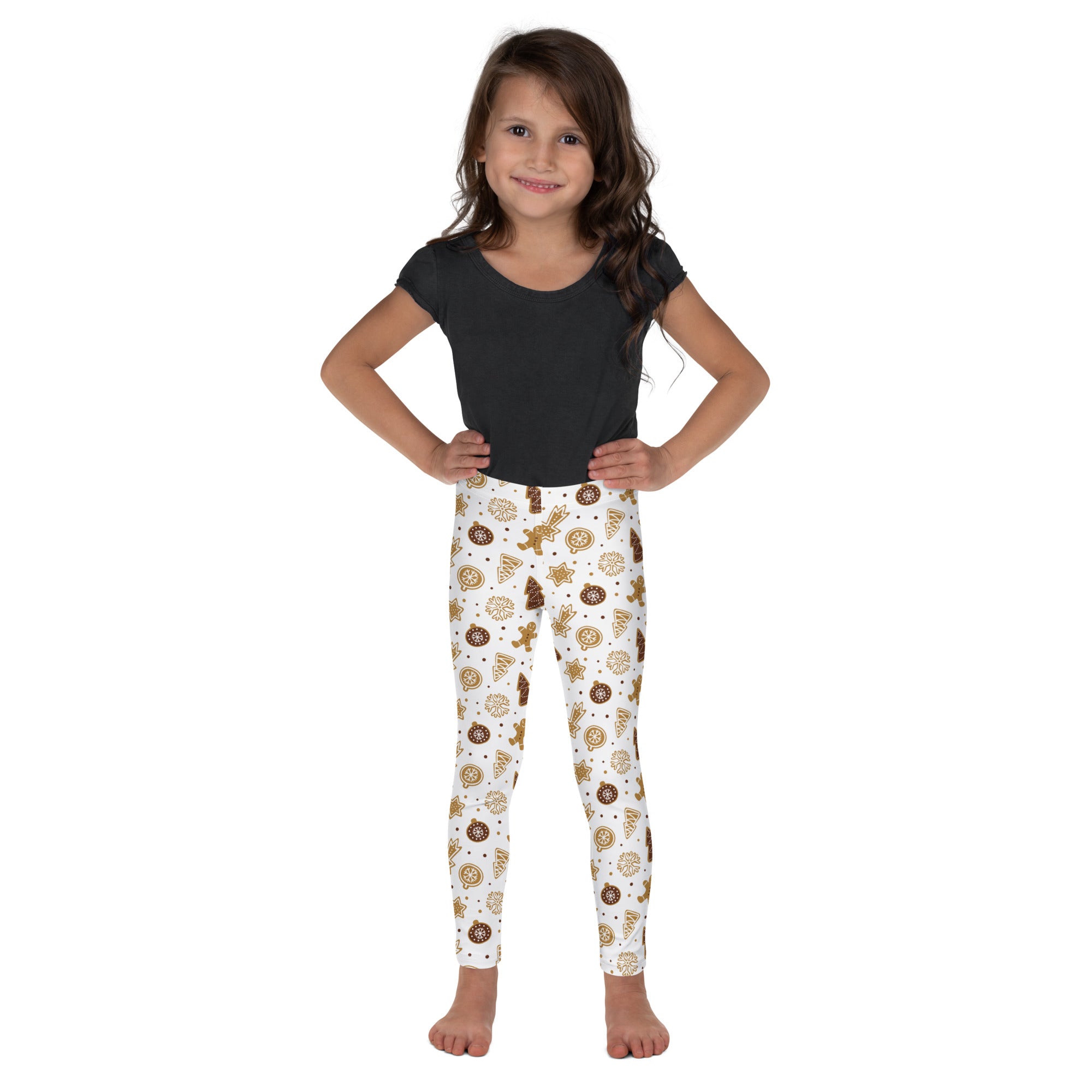 White kids gingerbread christmas leggings with playful golden and brown cookie pattern buttery soft festive wear