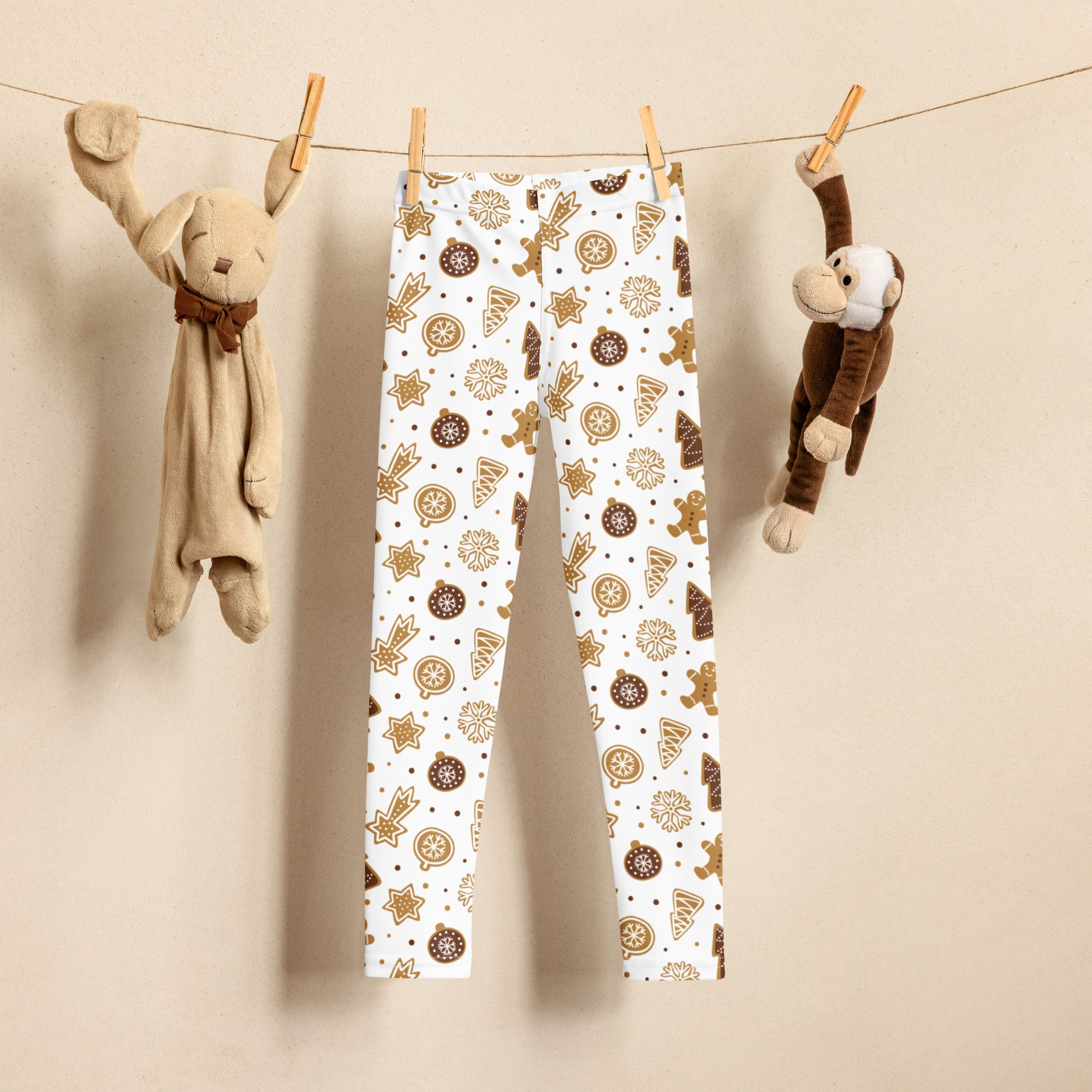 Kids gingerbread christmas leggings in white with festive brown holiday pattern made of buttery soft fabric