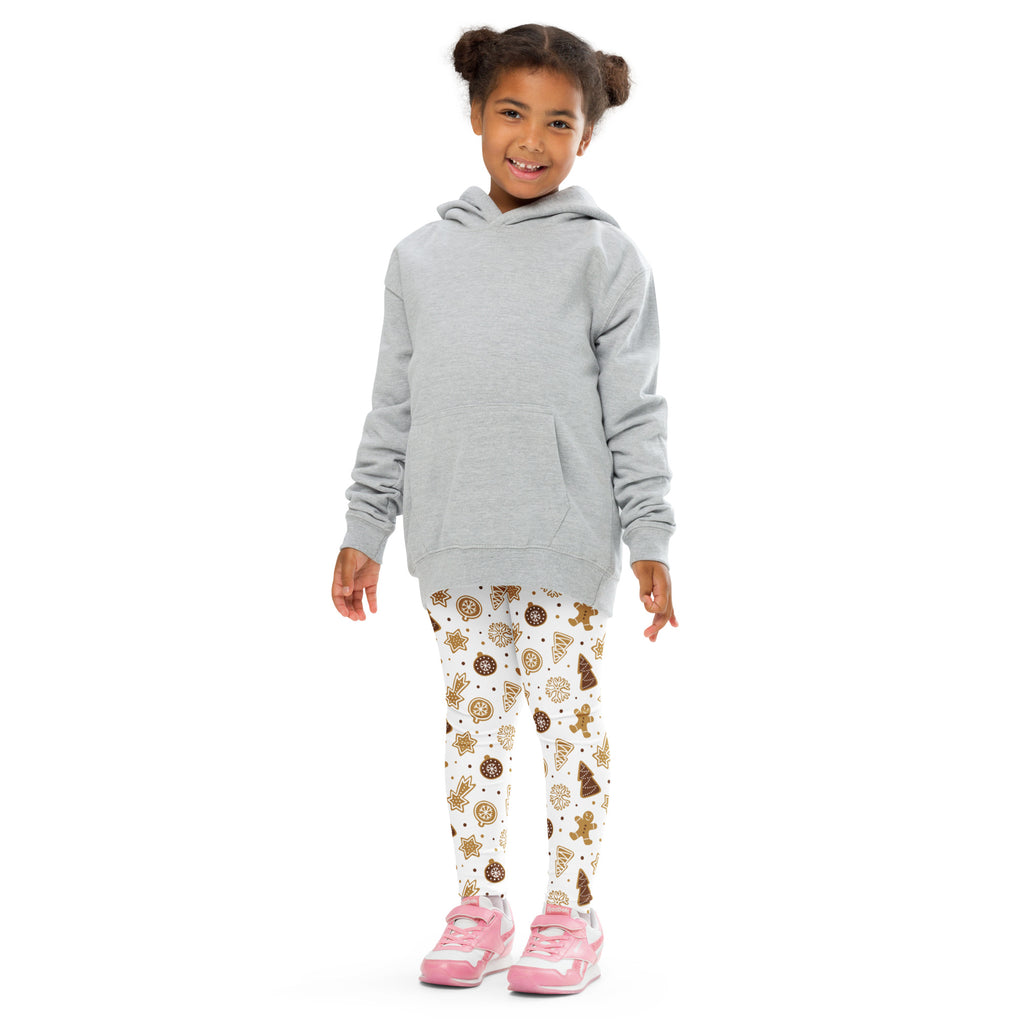 Gray hooded sweatshirt with front pocket and long sleeves worn over buttery soft kids gingerbread christmas leggings with cookie pattern