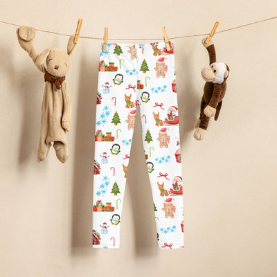 White kids christmas buttery soft leggings with festive gingerbread men reindeer snowmen candy canes and trees design