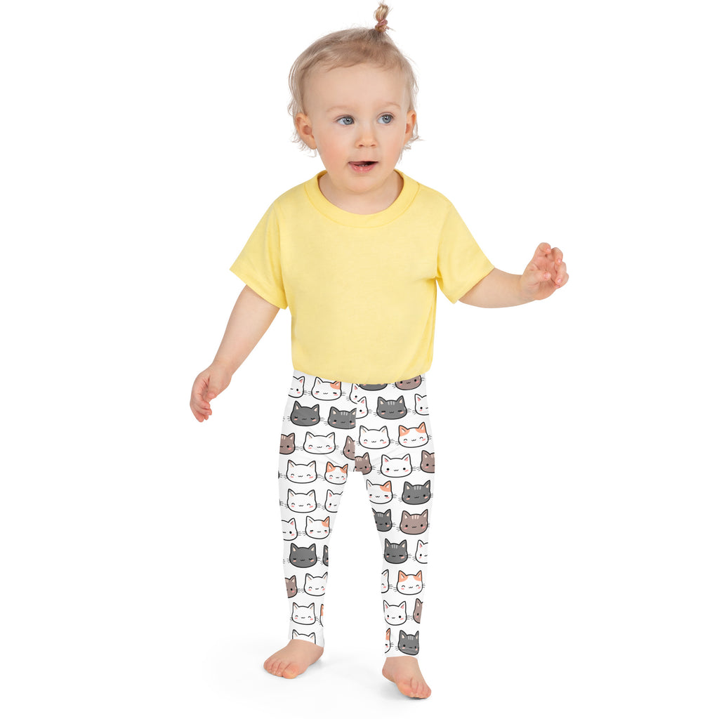 Yellow short-sleeved t-shirt paired with girls cat buttery soft white leggings with colorful cartoon cat pattern