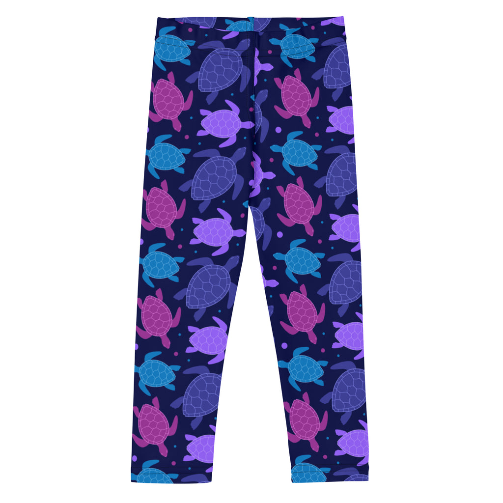 Girls purple sea turtle buttery soft leggings with purple and teal sea turtle patterns on a dark navy background