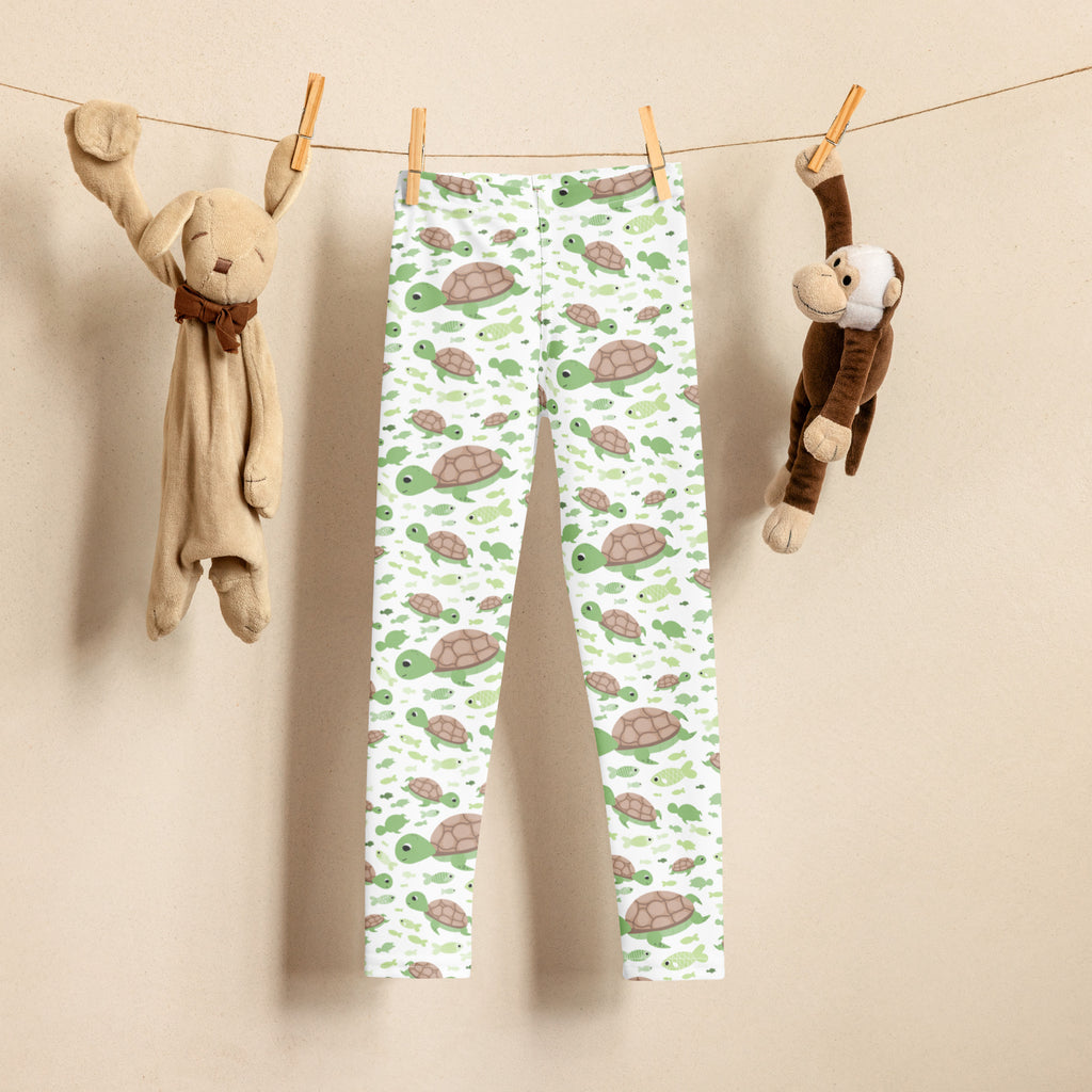 Kids green sea turtles buttery soft white leggings with playful green and brown turtle pattern for comfortable wear