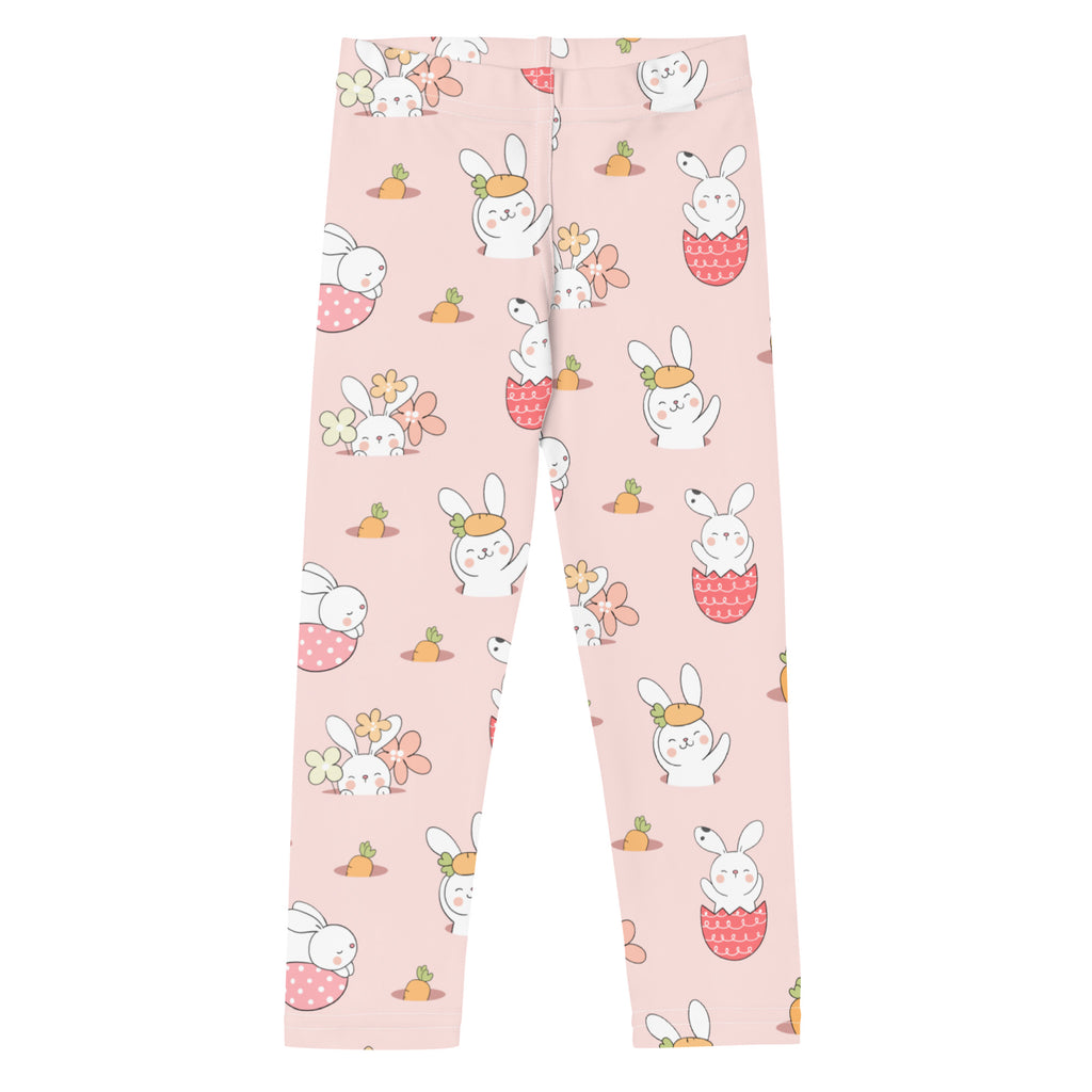 Kids easter bunny pattern buttery soft pink leggings with white cartoon bunnies in easter poses and scattered carrots and flowers