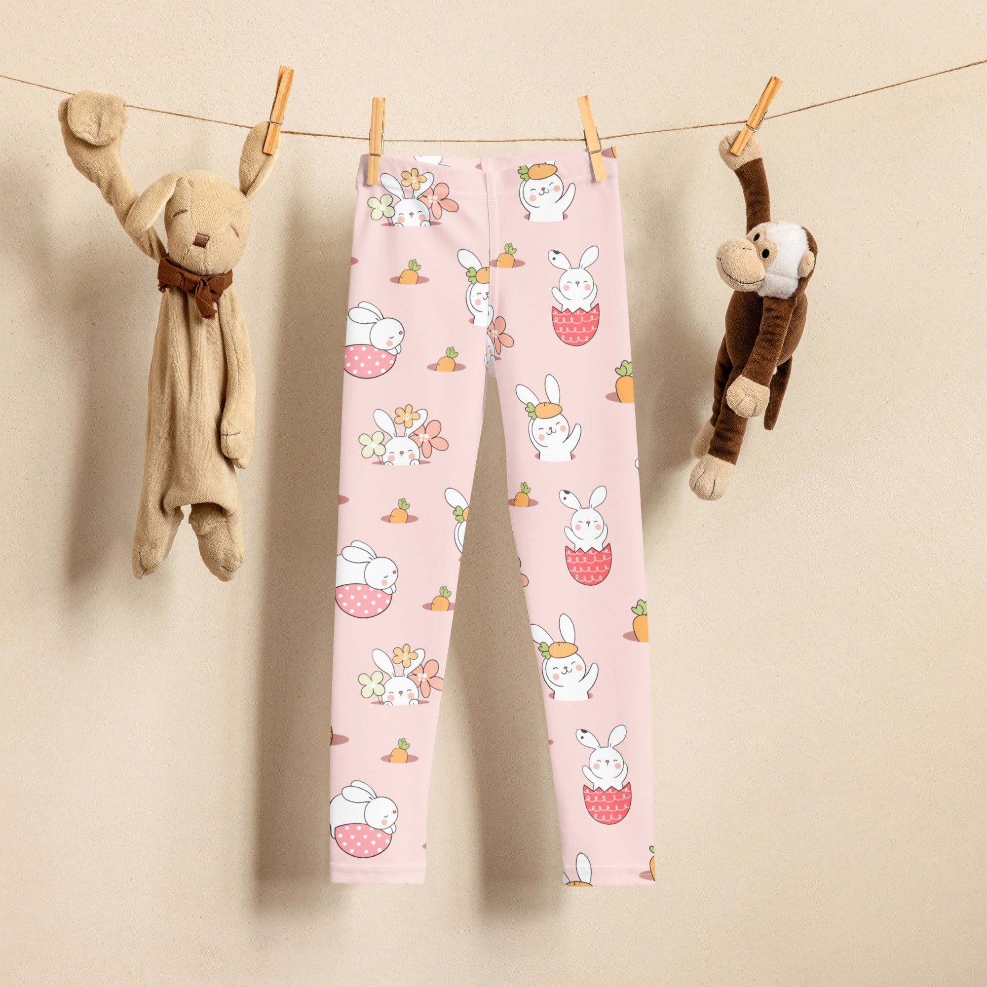 Kids easter bunny pattern buttery soft pink leggings with playful white bunnies carrots and flowers design