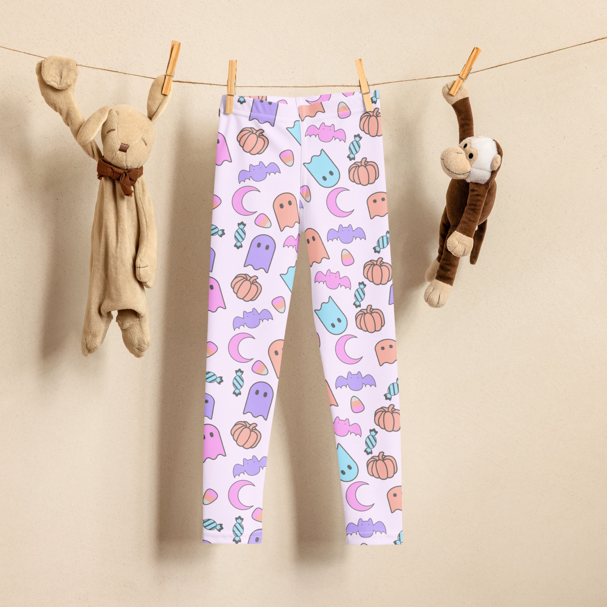 Girls halloween pattern buttery soft white leggings with pastel ghosts bats pumpkins and moons playful design