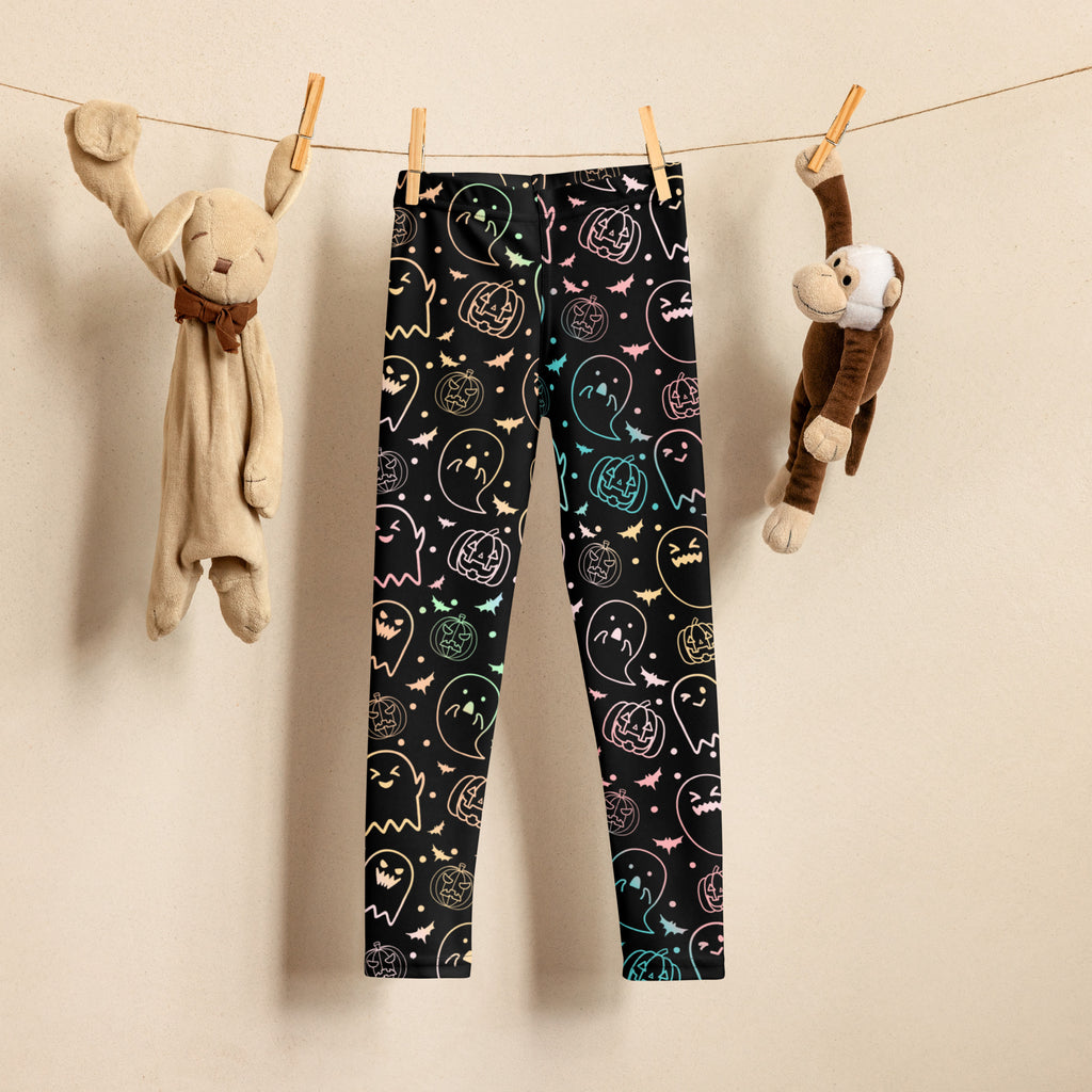 Girls colorful neon Halloween buttery soft black leggings with glowing ghost and pumpkin designs in pastel rainbow hues