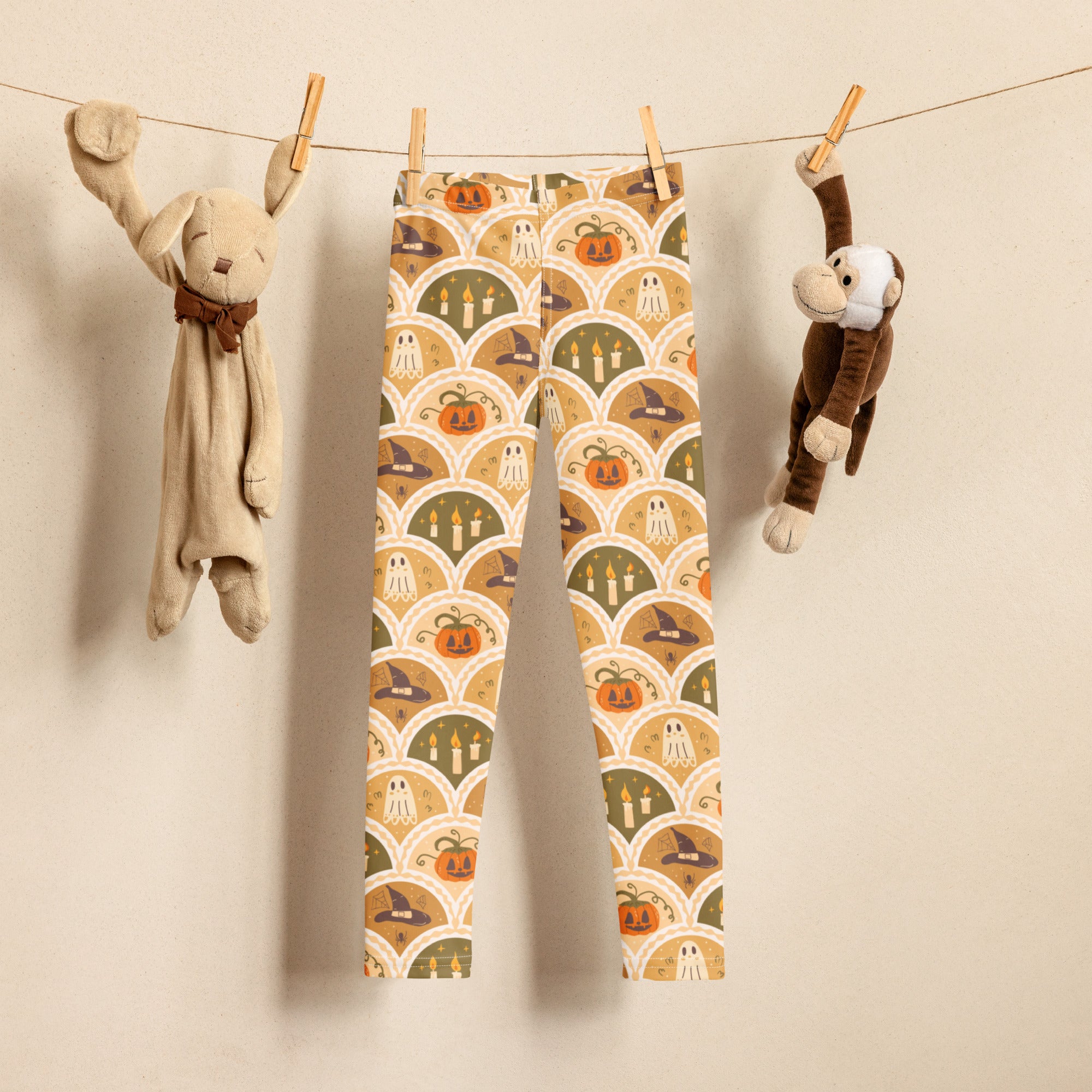 Kids autumn themed halloween buttery soft leggings with pumpkins ghosts and witch hats in orange beige green and cream tones