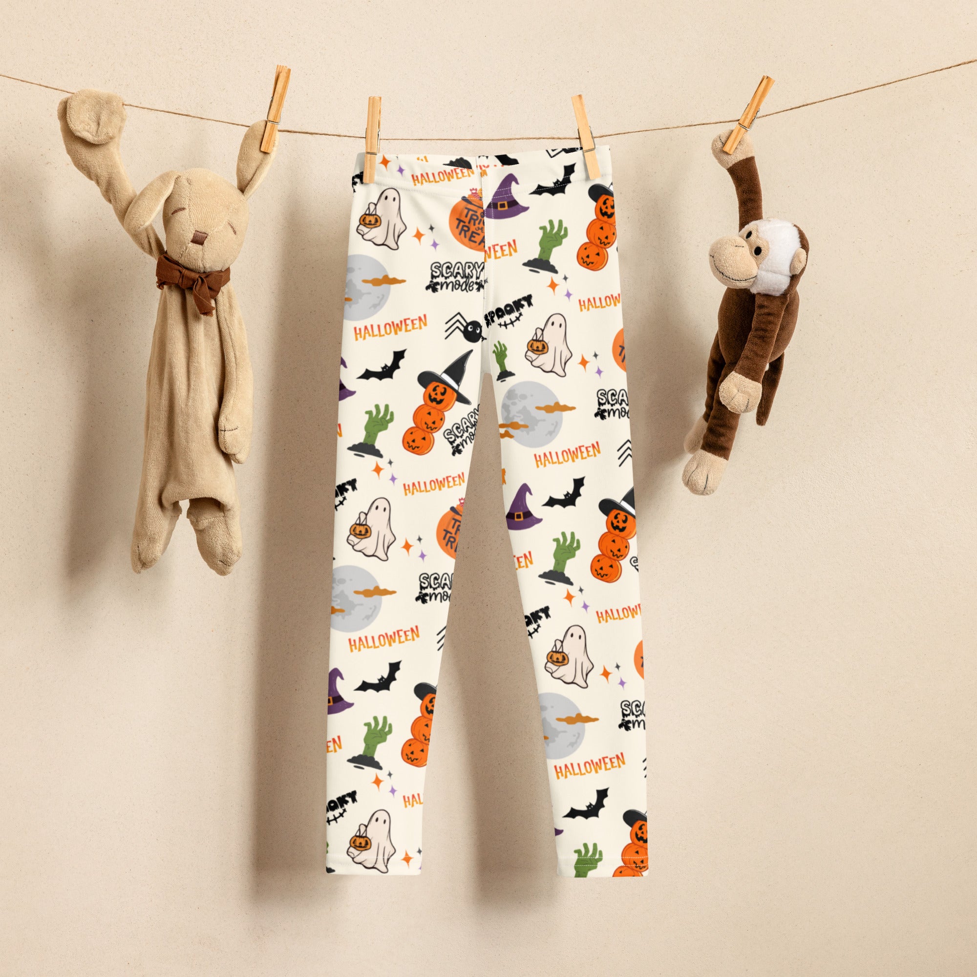 Kids trick-or-treat halloween buttery soft white leggings with playful orange black and green ghost pumpkin bat and witch hat prints