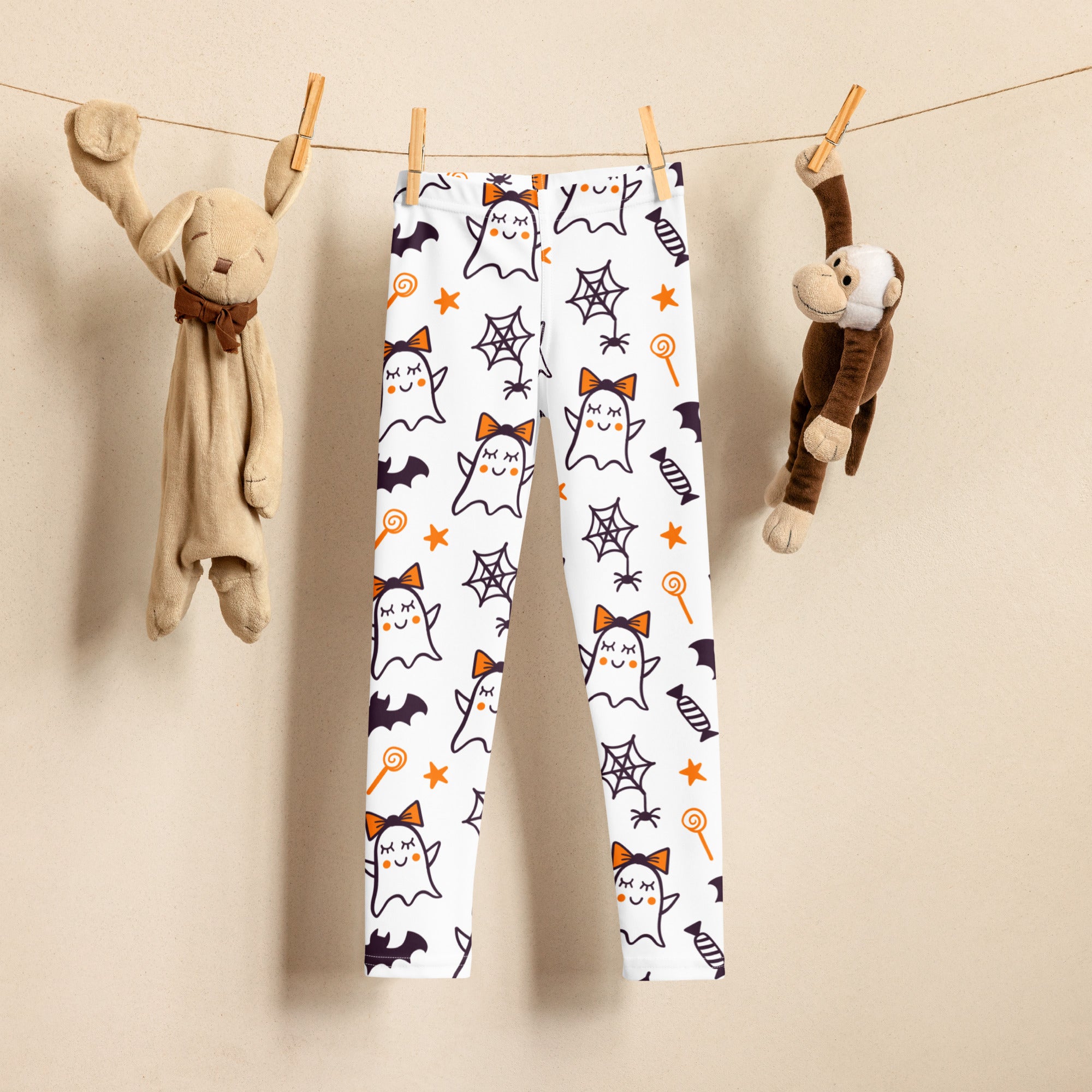 Girls cute ghost bow buttery soft white leggings with playful black orange and purple halloween ghost bat and candy designs